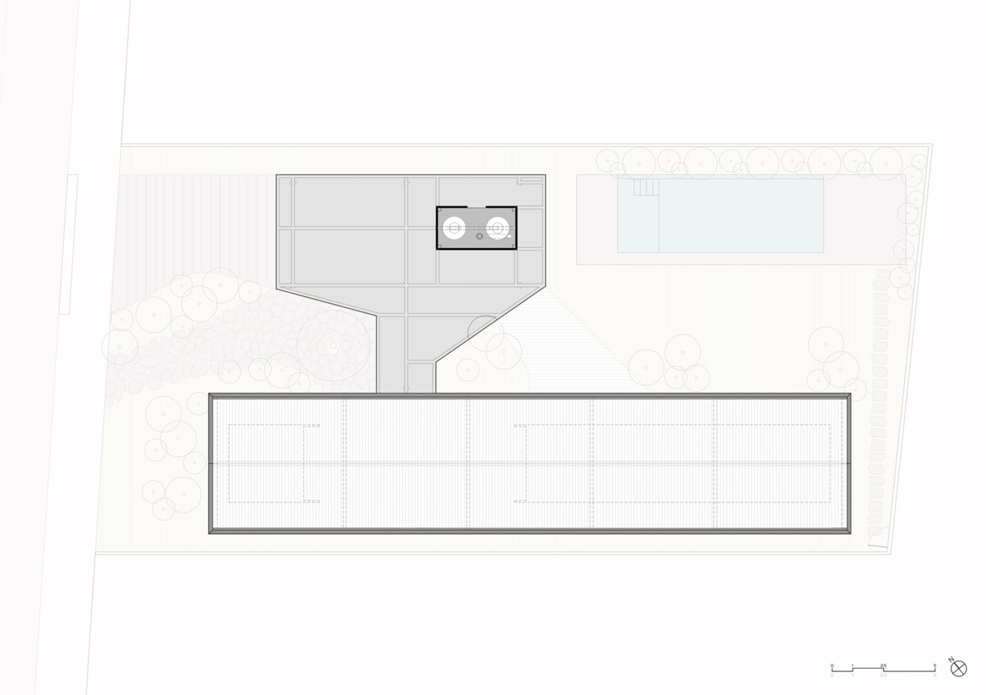A modern floor plan featuring a concrete structure with a rectangular layout and a central open space.