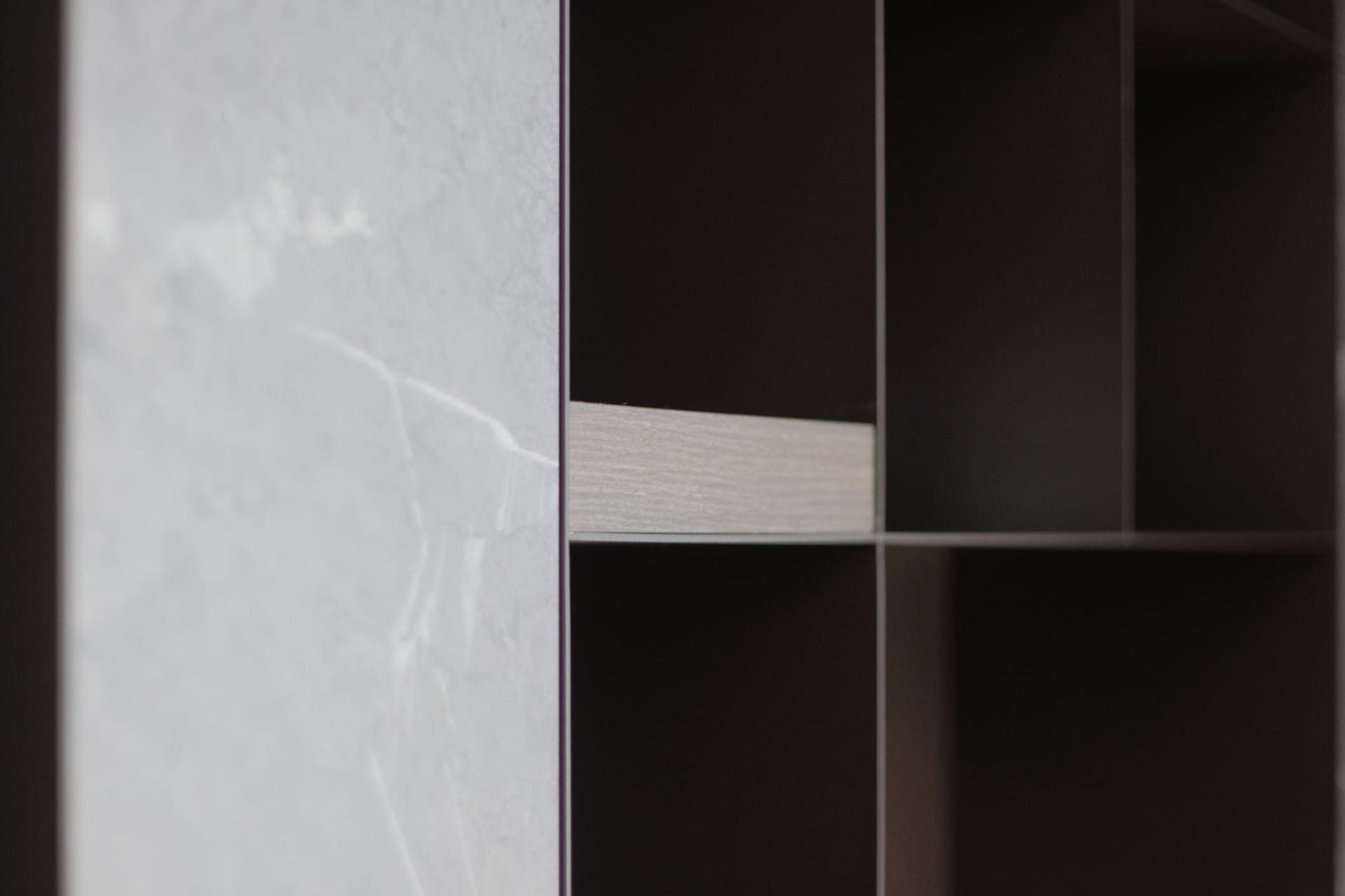 A close-up view of an industrial storage unit designed with a combination of marble and concrete materials.
