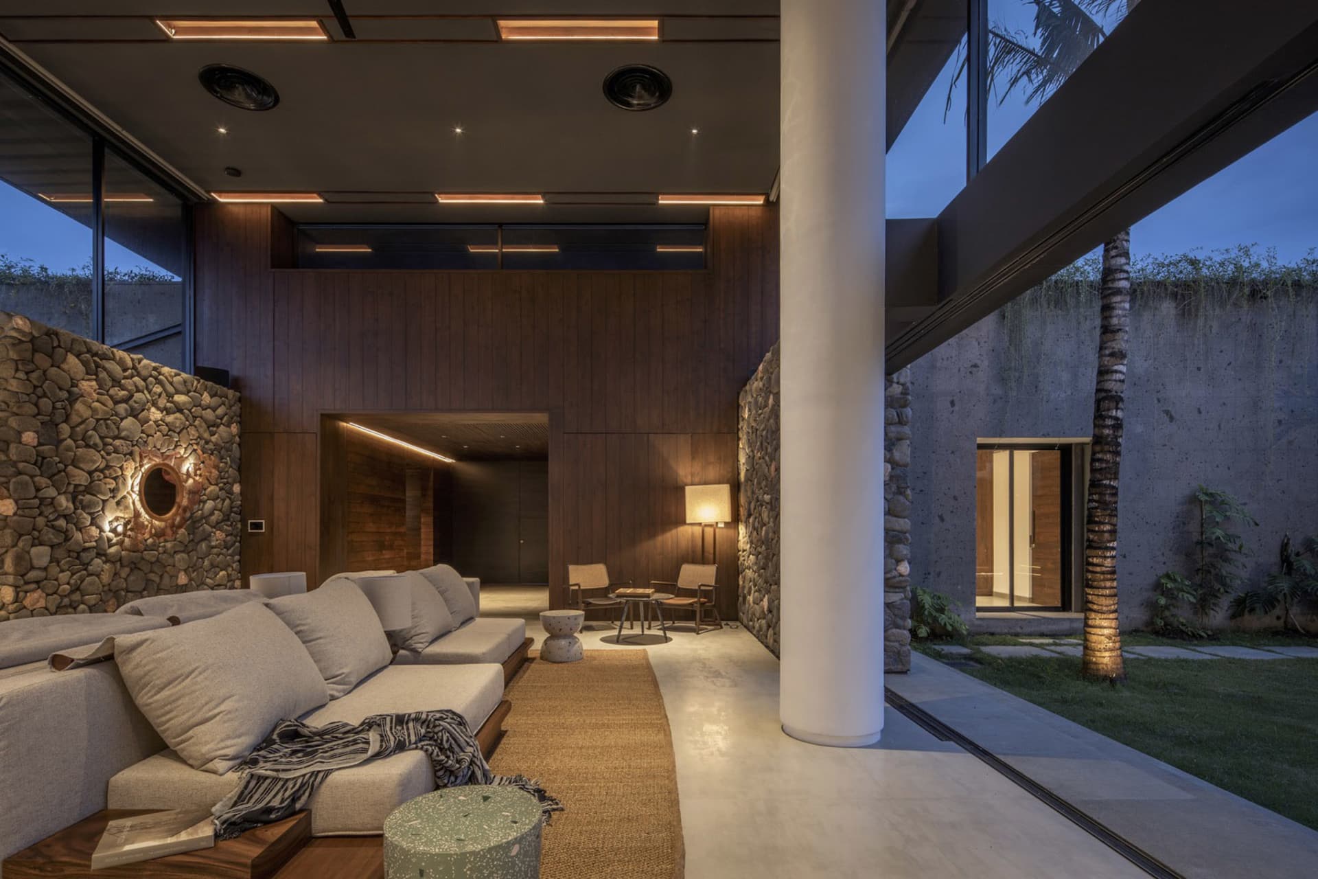 A modern residential space featuring concrete walls and a minimalist design.