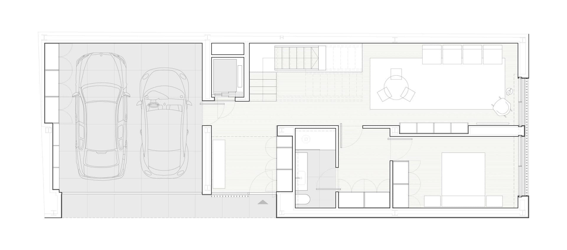 Floor plan of a modern house with wood flooring and concrete elements.