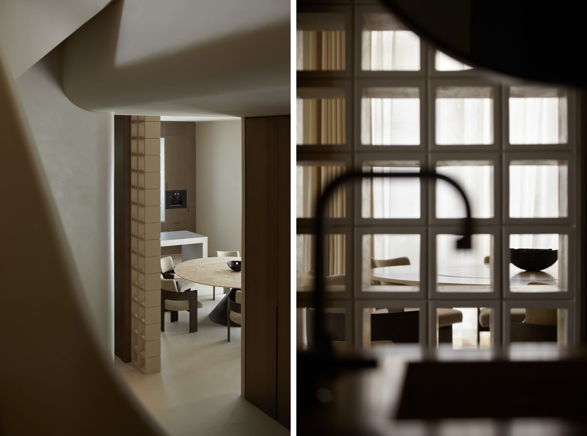 Modern residential kitchen featuring a round marble table and contemporary seating arrangement.
