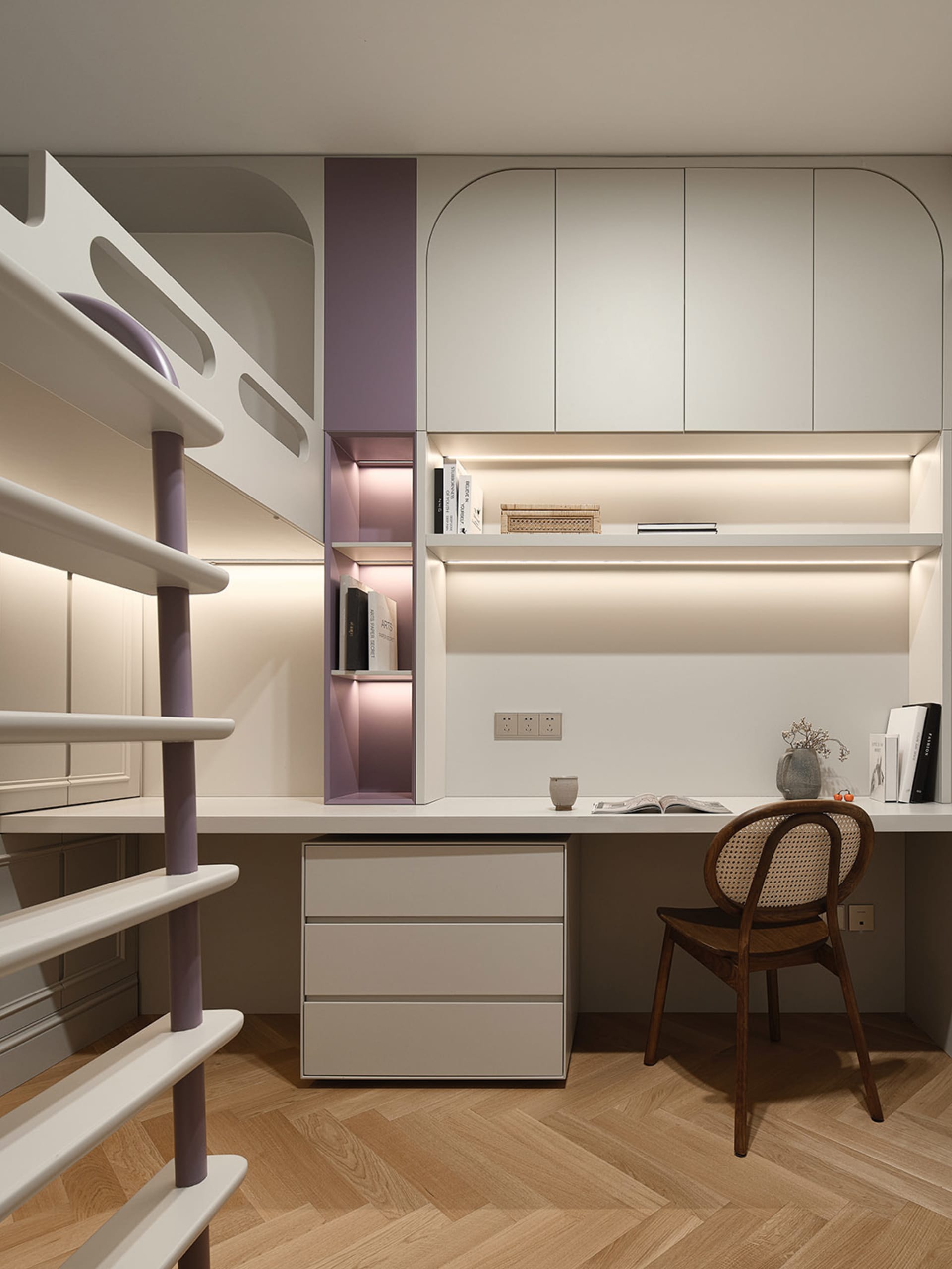 A minimalist study room with modern furniture and lighting.