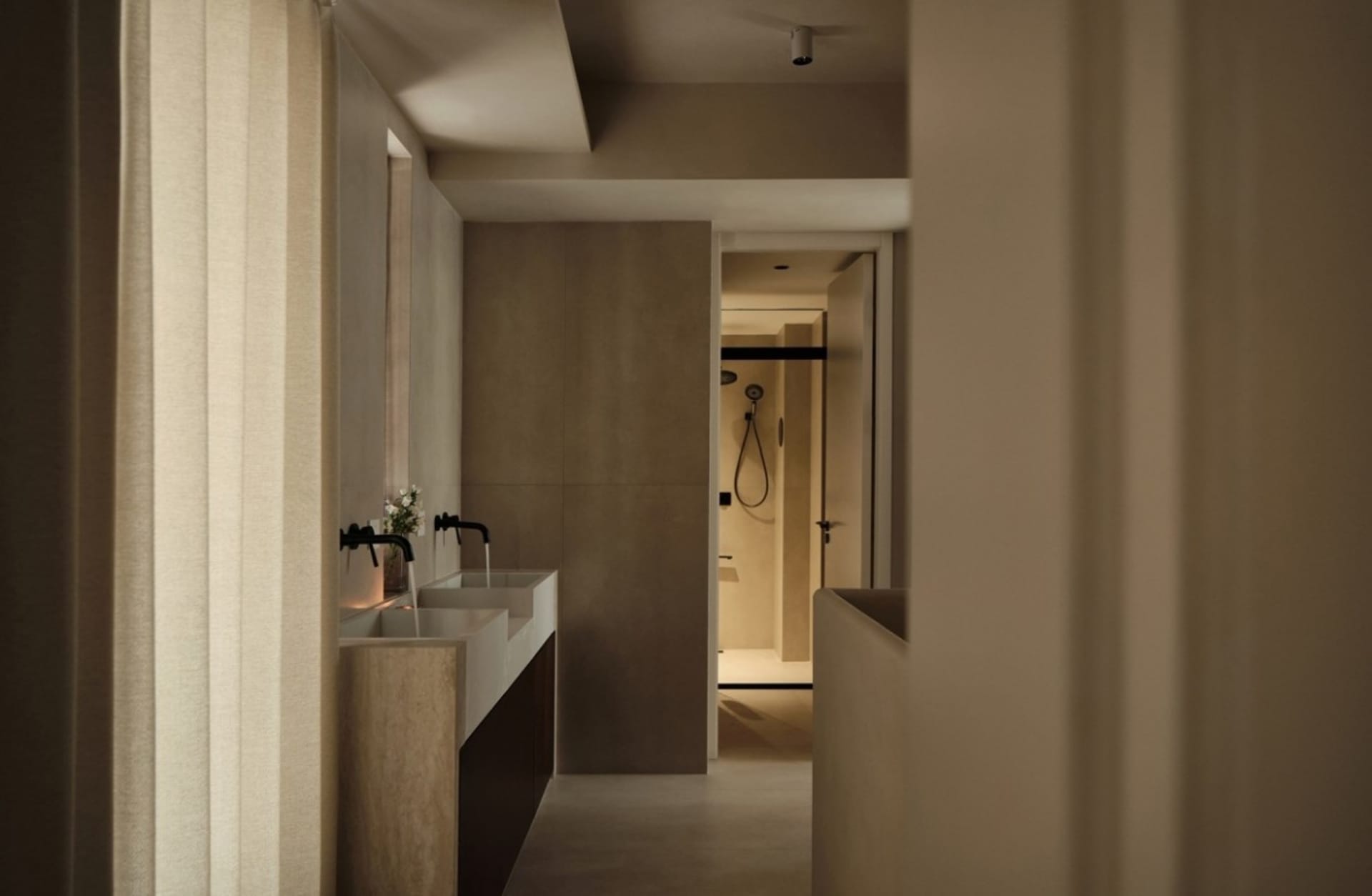 A modern bathroom featuring concrete tiles flooring and walls.