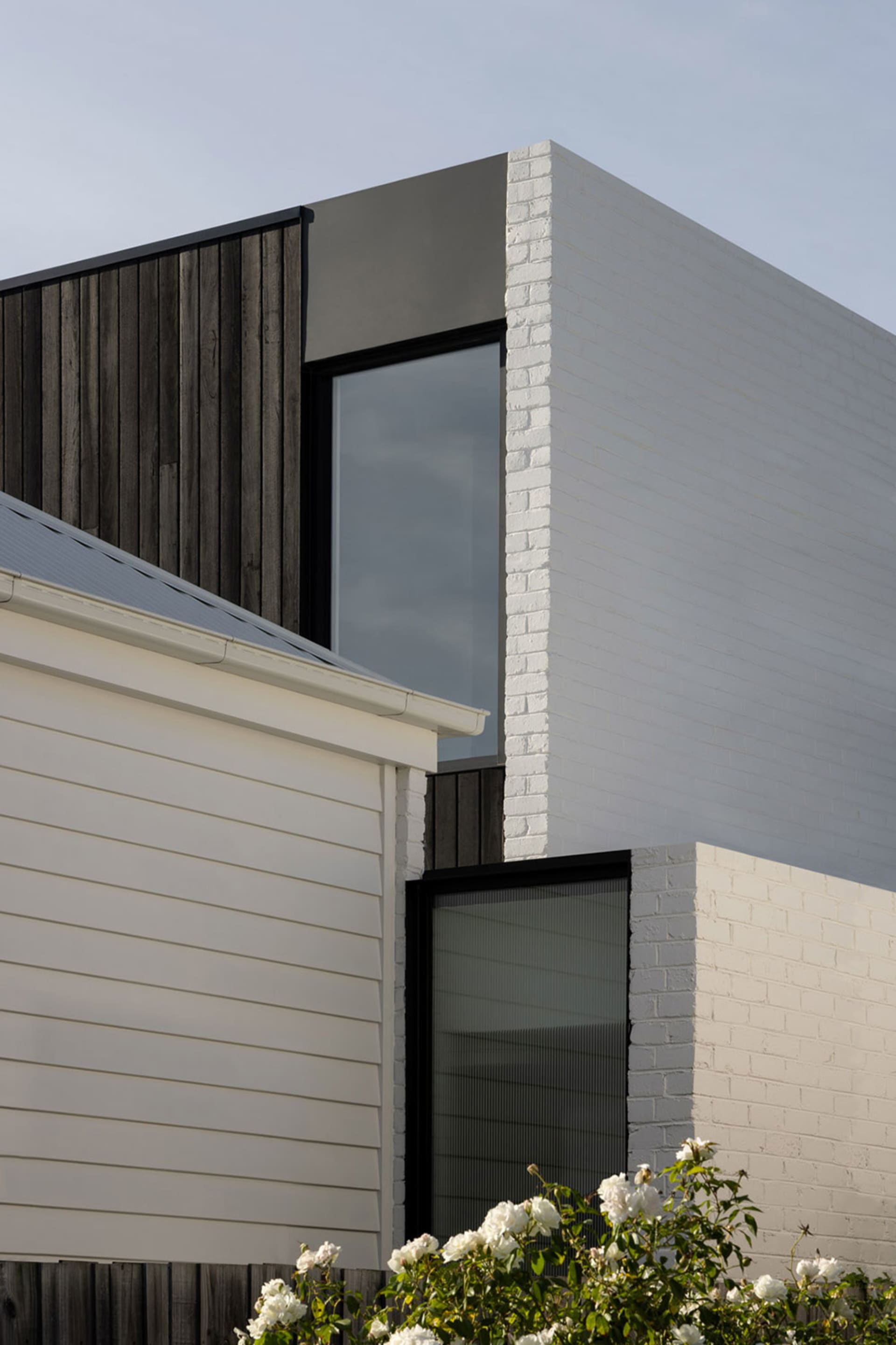 A modern architectural structure featuring brick materials.