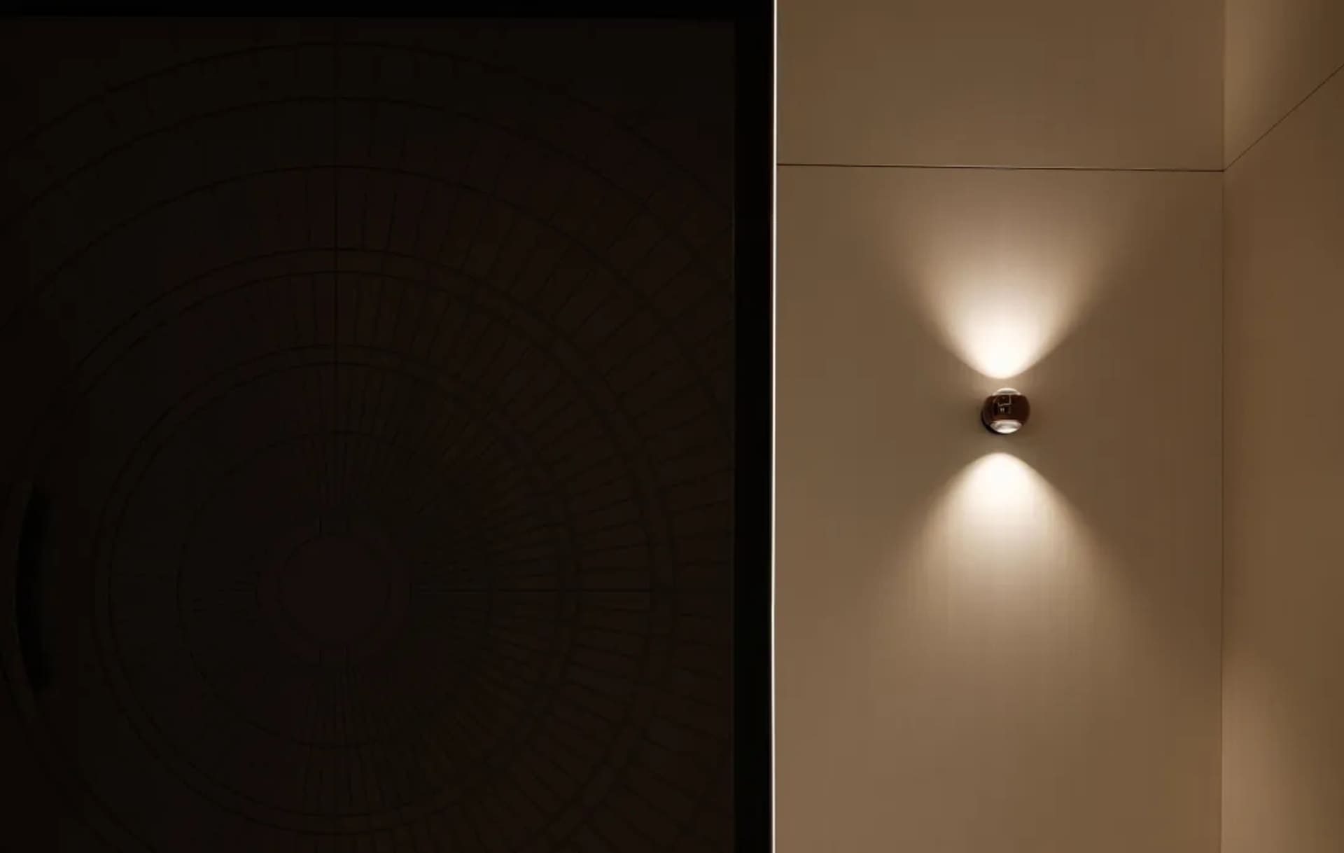 A modern example of steel lighting fixtures mounted on a wall.