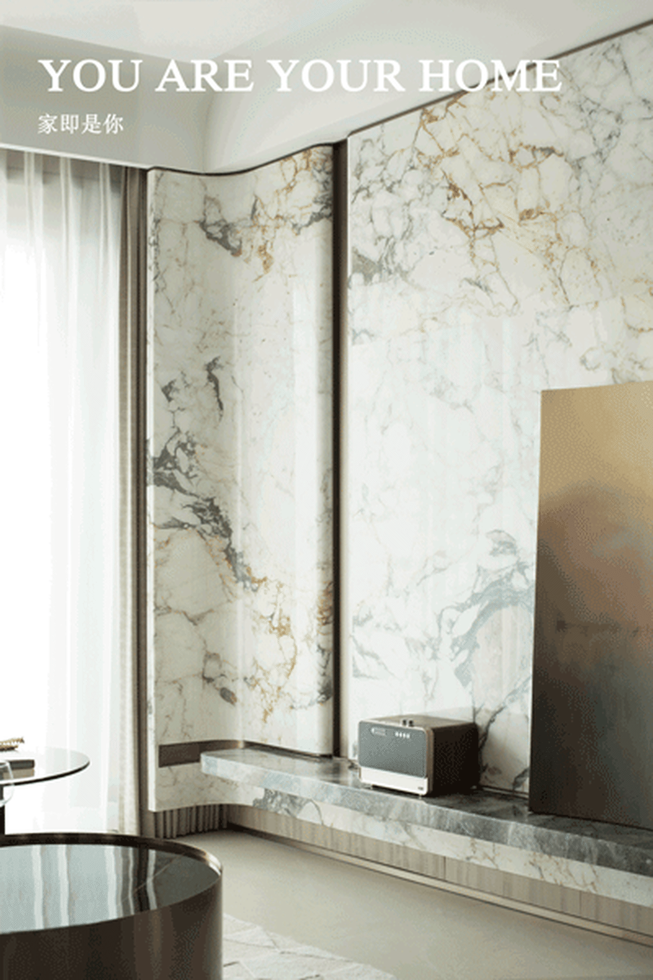 Modern interior design featuring marble walls and floor in a living room.