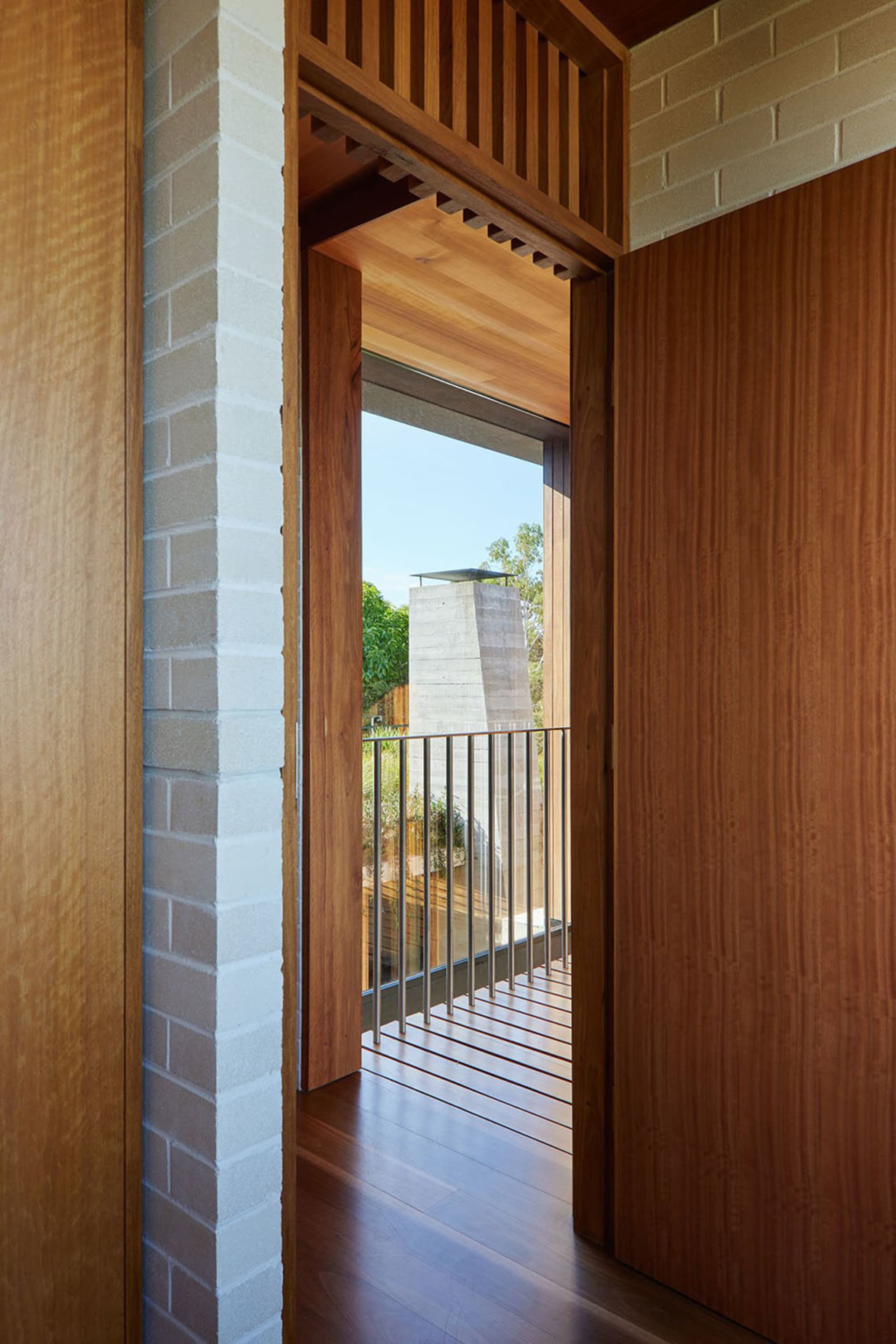 A modern interior with wooden walls and a glass window.