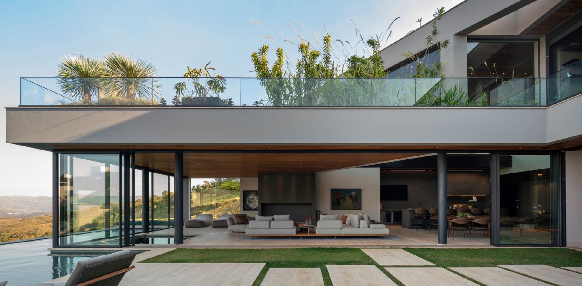 Modern residential interior featuring a concrete and glass design.