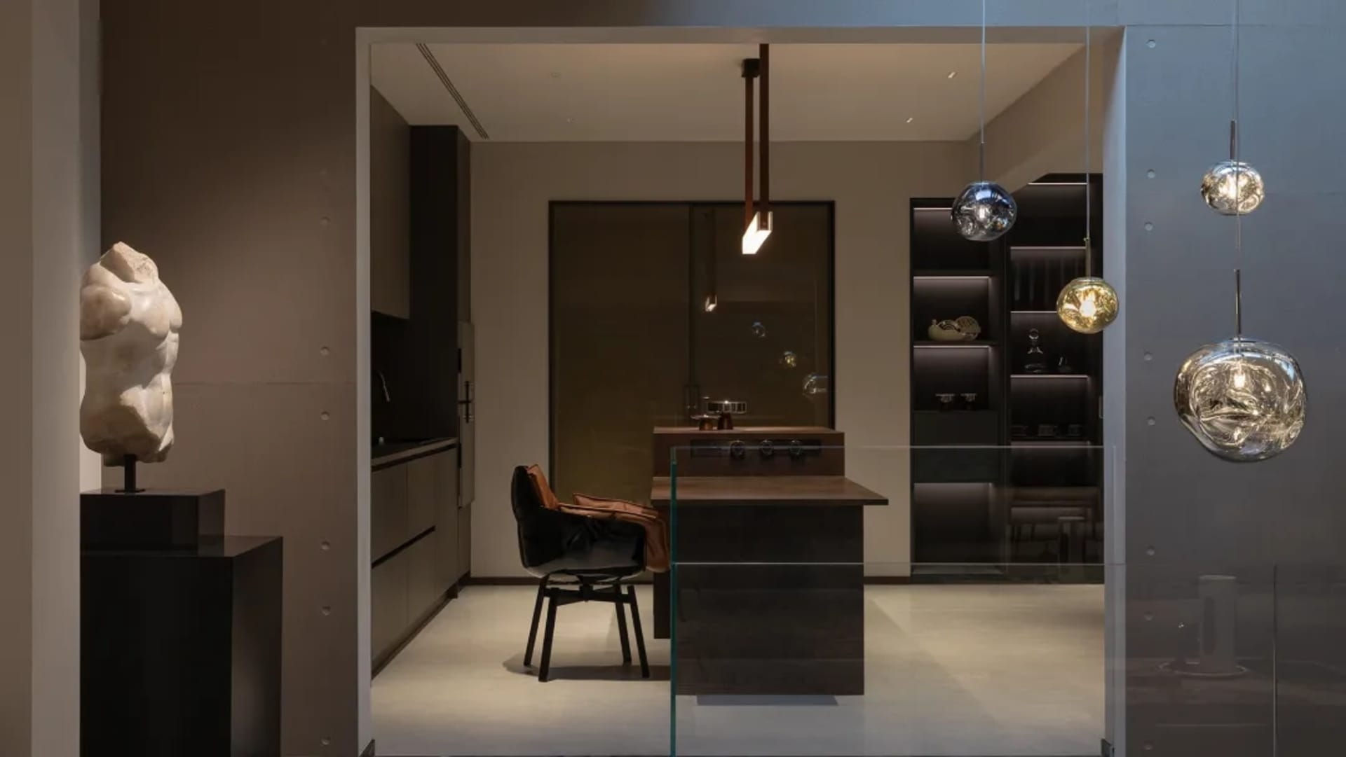 Modern kitchen with metallic finishes, featuring sleek design elements and contemporary fixtures.