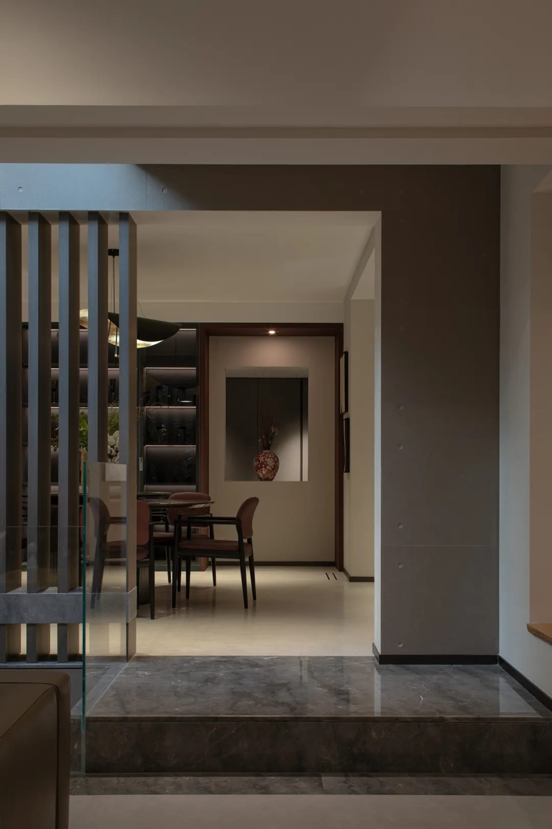 Modern minimalist living room featuring marble flooring and contemporary furniture.
