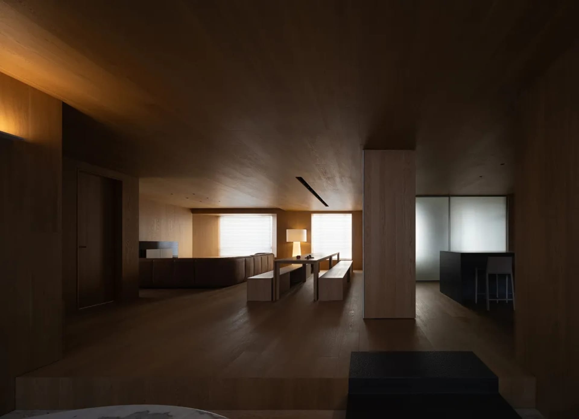 Modern living room with wooden walls, furniture, and floor, featuring a minimalist design style.