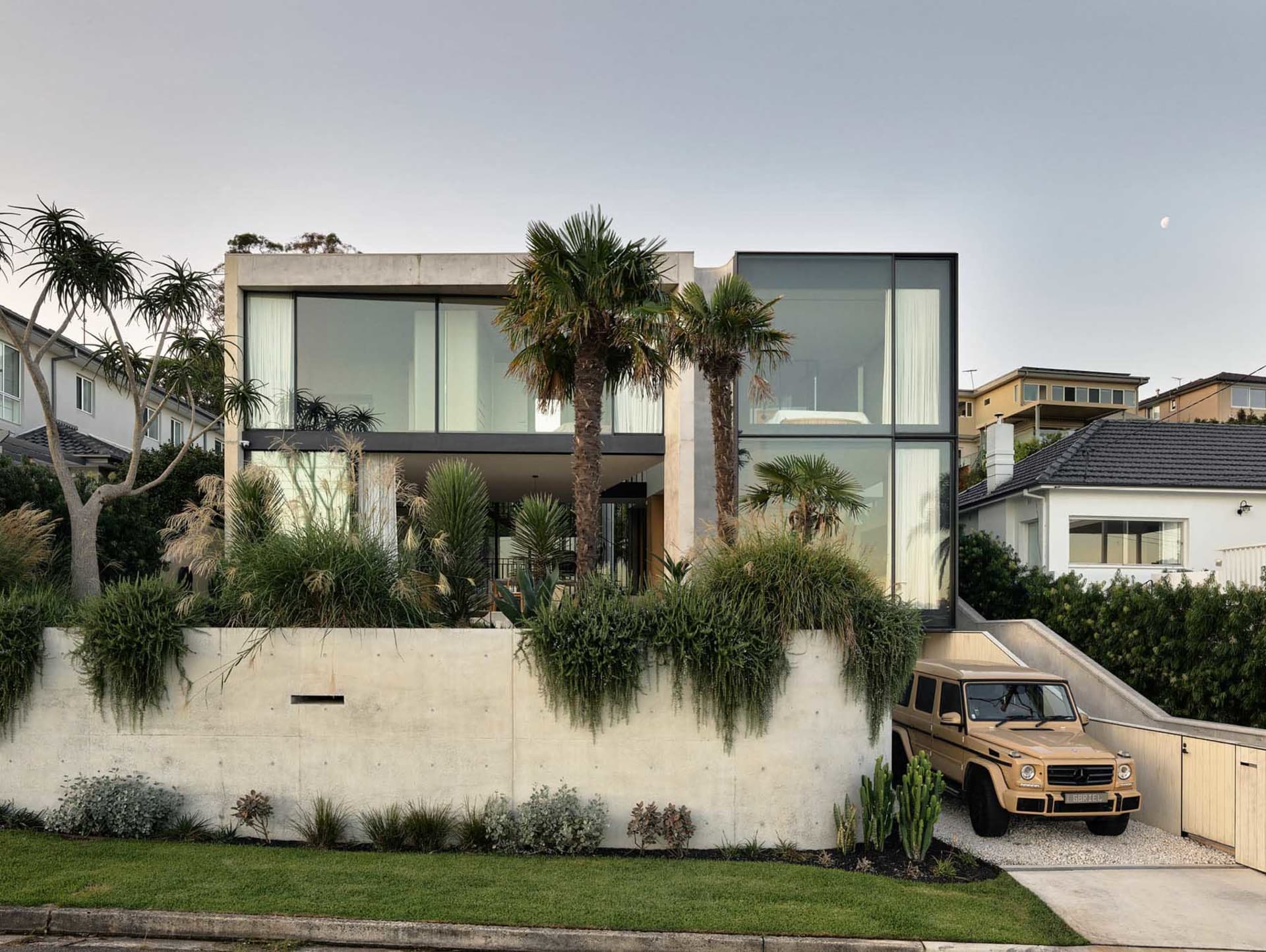 Modern residential home with concrete and glass facade
