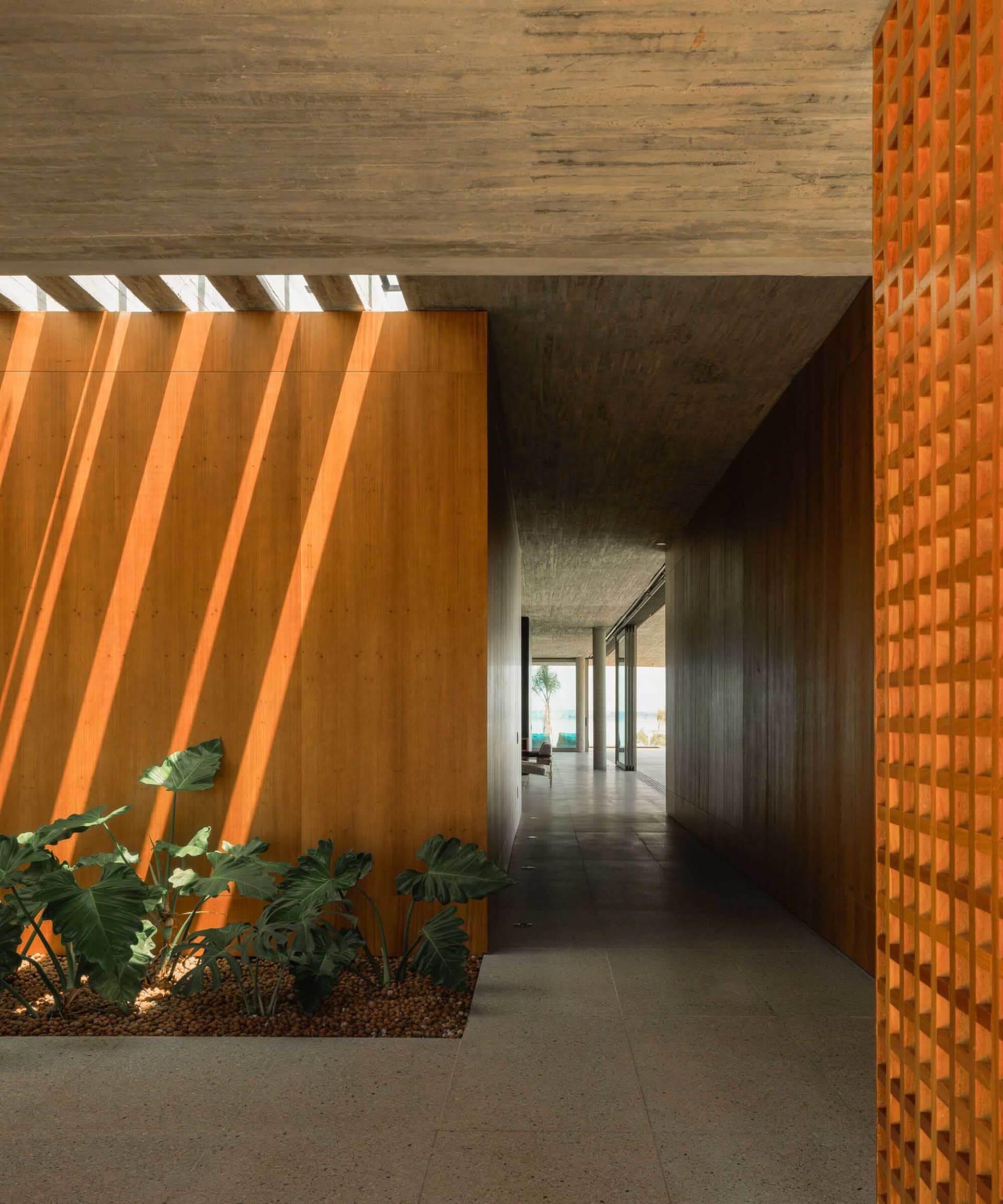 Modern architectural space featuring concrete and wooden walls.