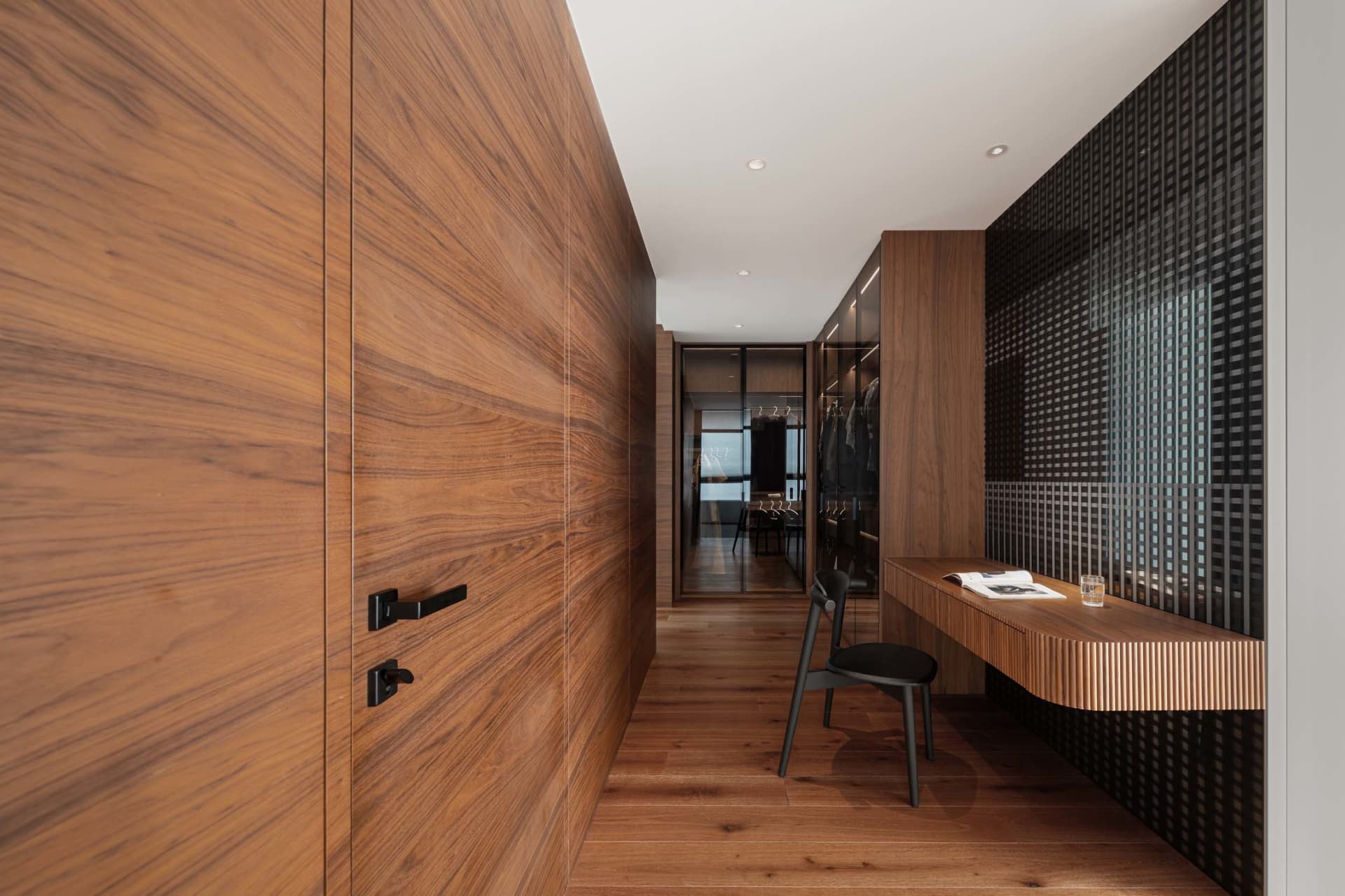 A modern wardrobe with wooden panels and minimalist design.