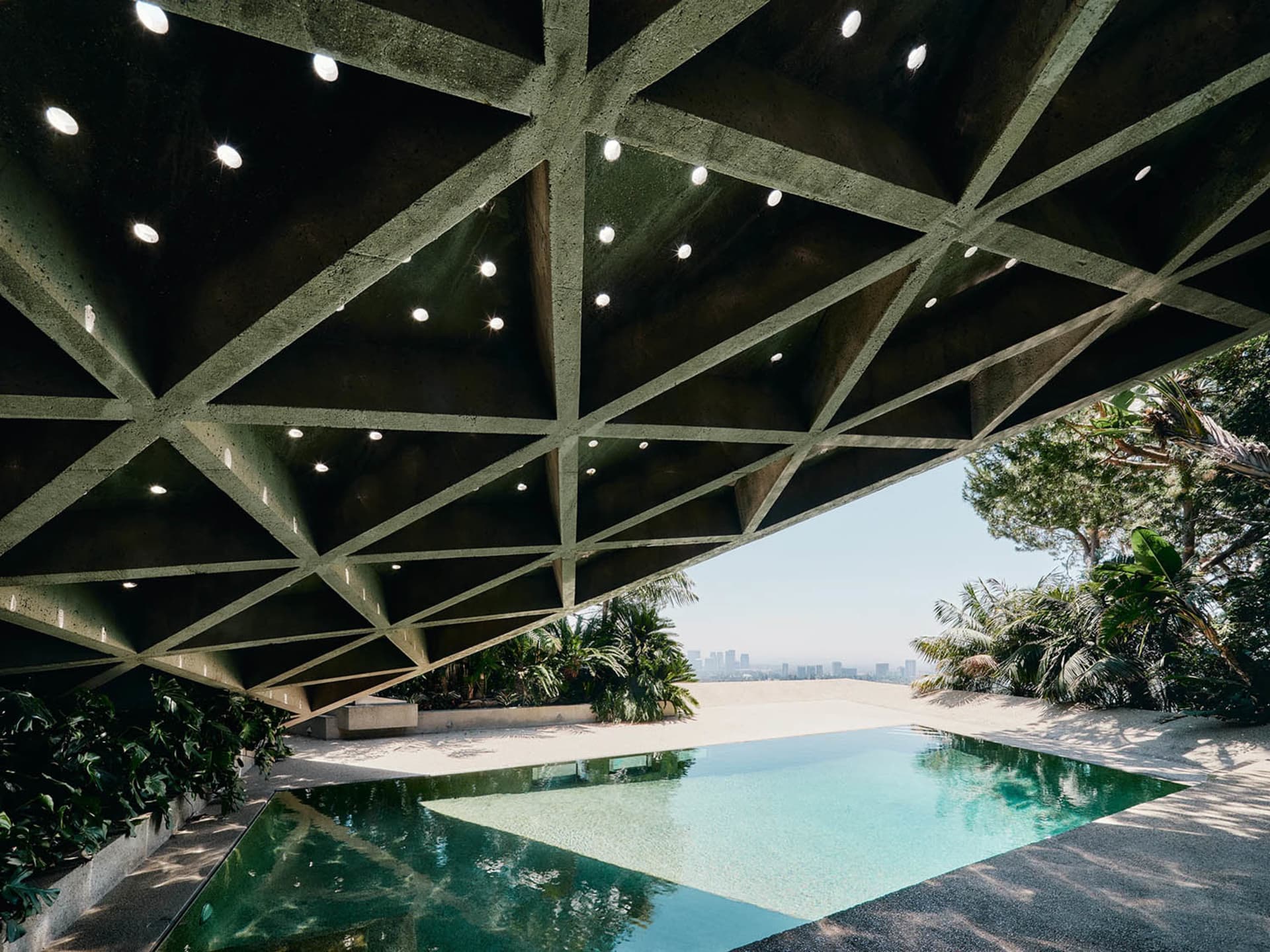 An architectural image showcasing a modern residential interior with concrete materials.