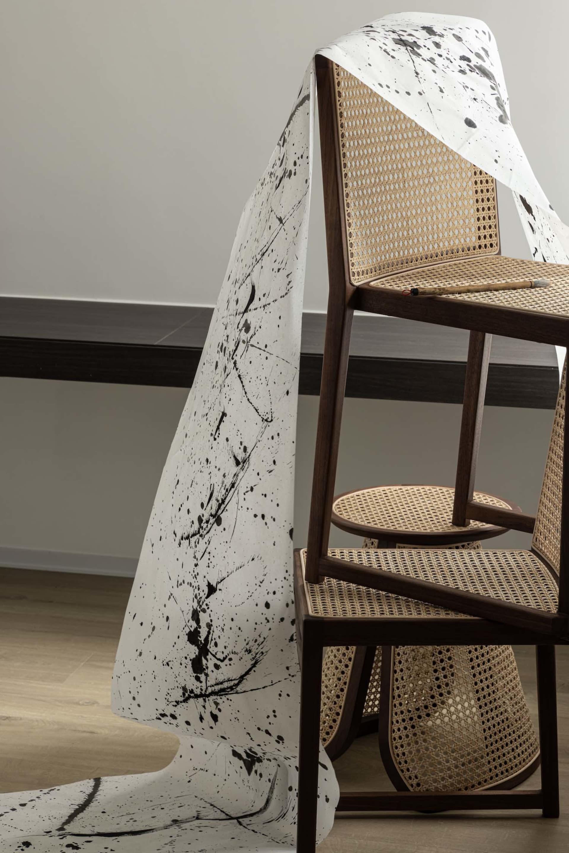 An abstract paper design hanging in a home office environment.