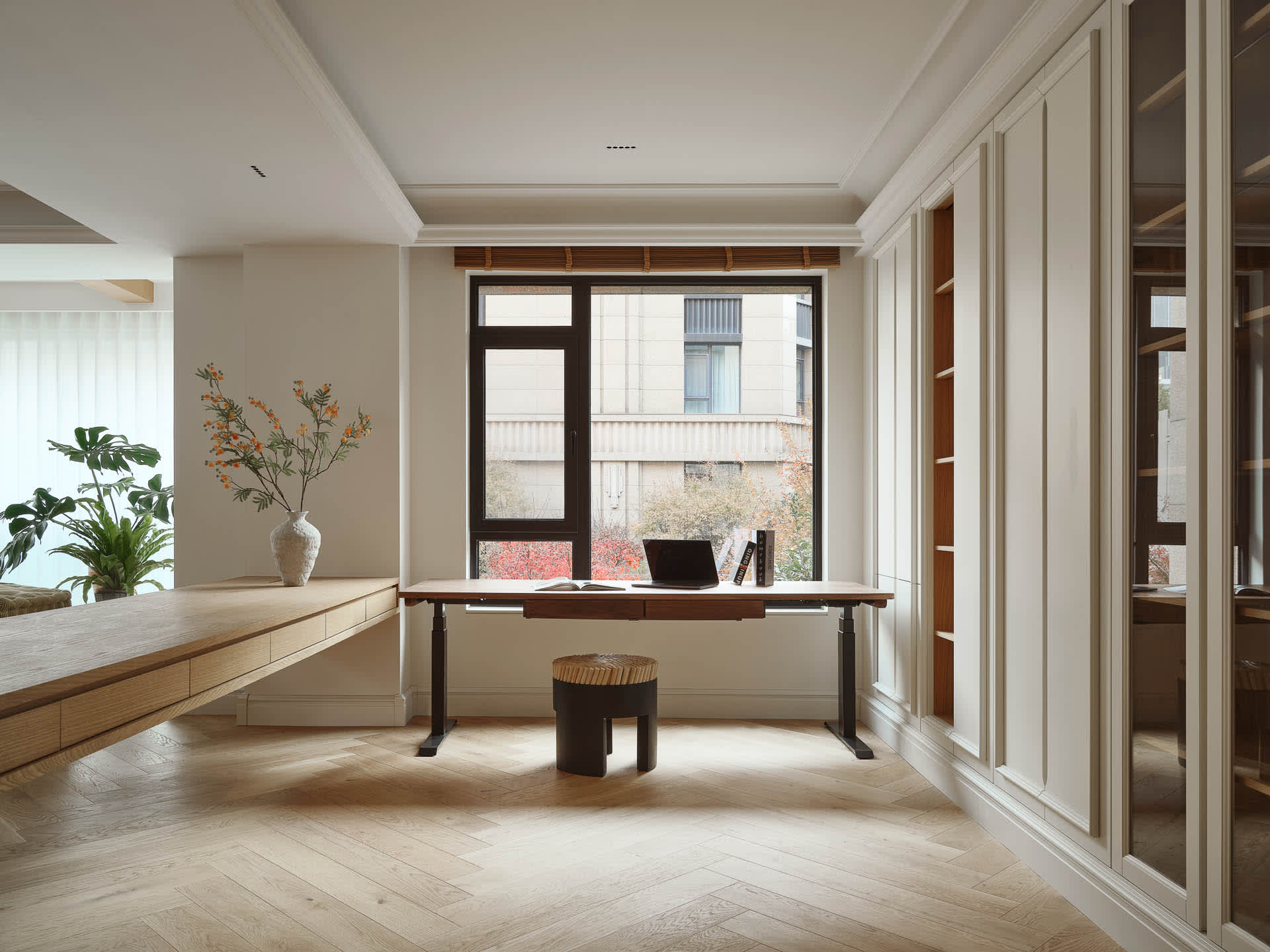 A minimalist office space featuring wooden and marble elements.