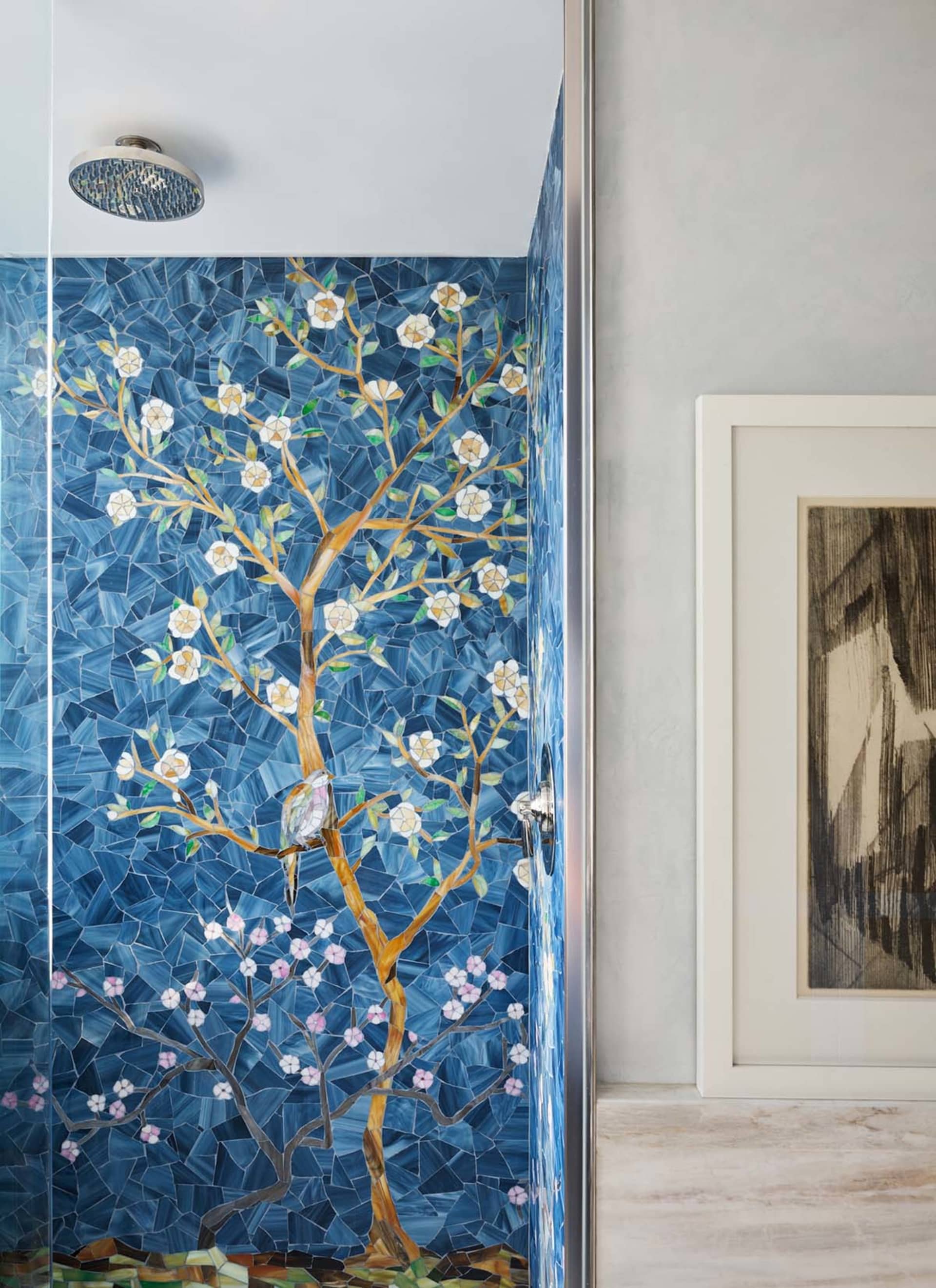 Bathroom interior featuring a blue glass mosaic tile wall