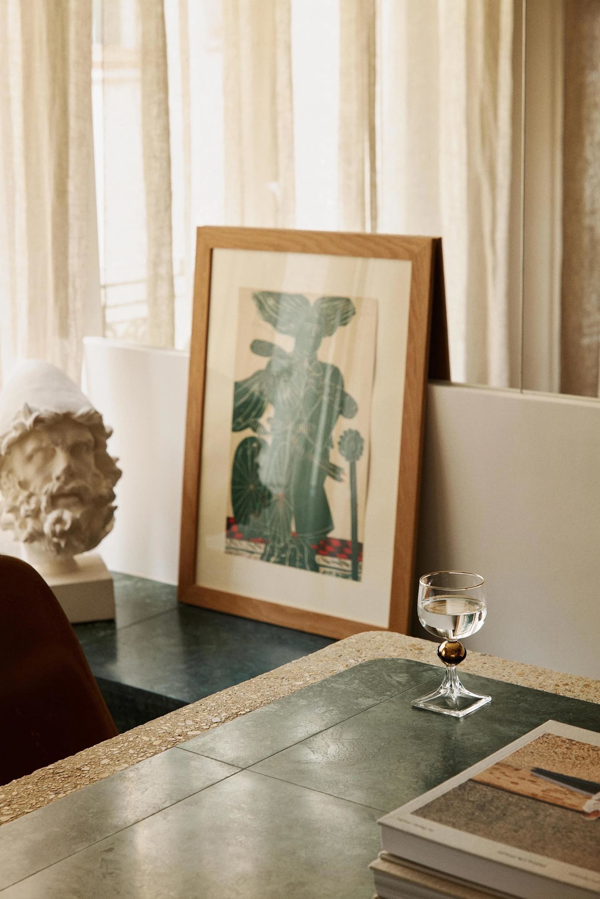 A modern interior setting featuring a concrete frame artwork in a contemporary space.