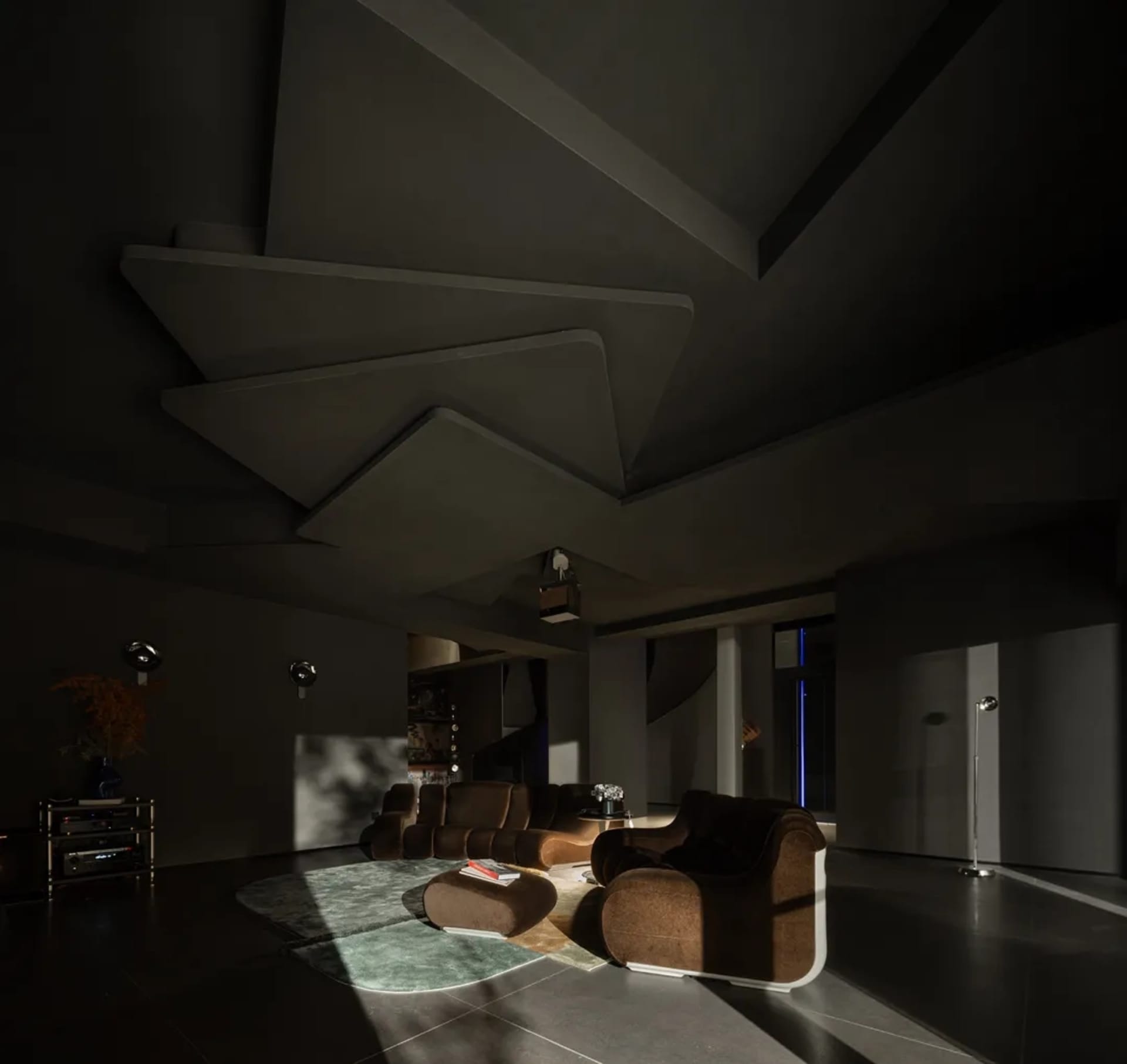 Modern living room design featuring concrete and glass materials.