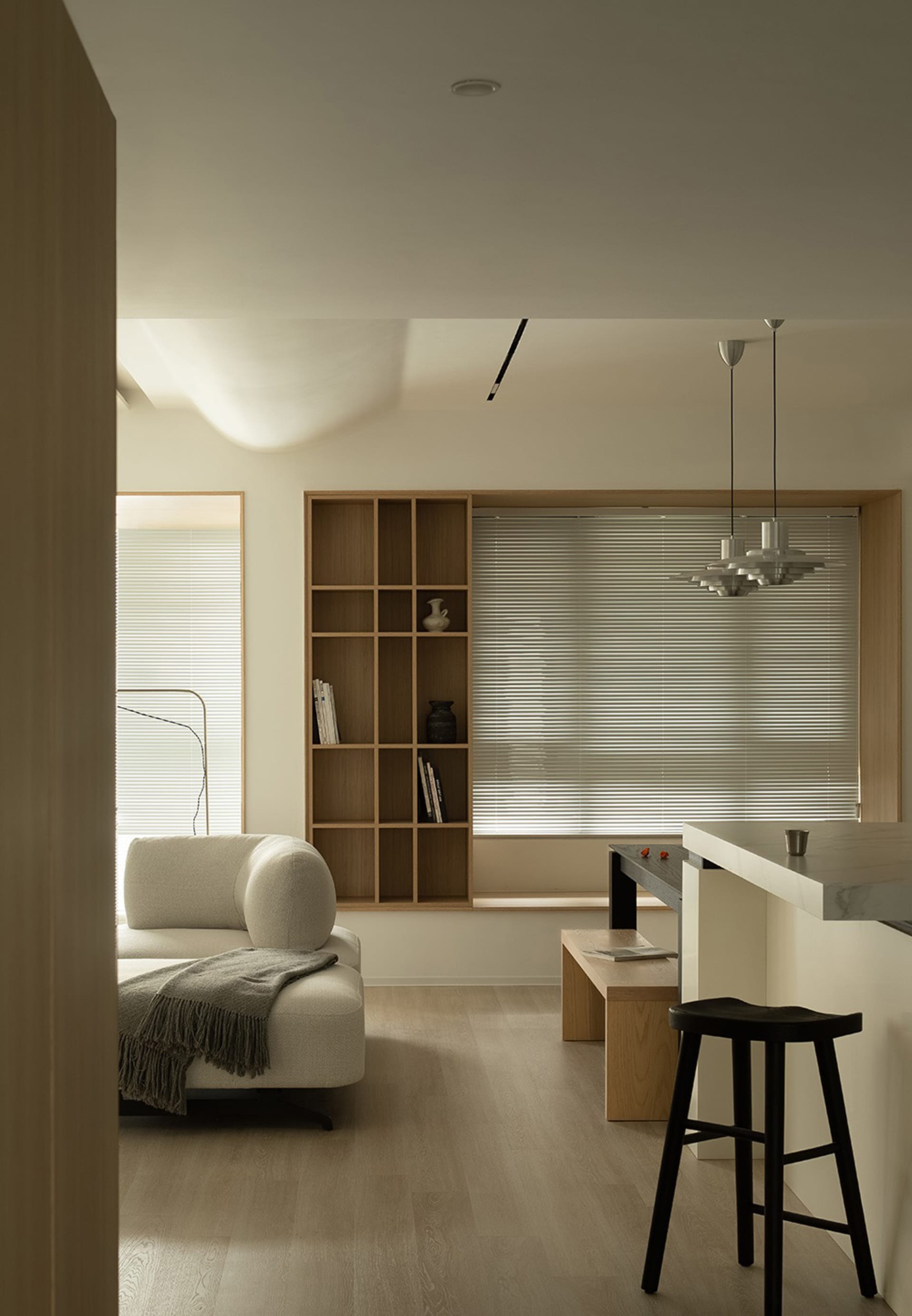 Contemporary living room featuring wood and marble elements.