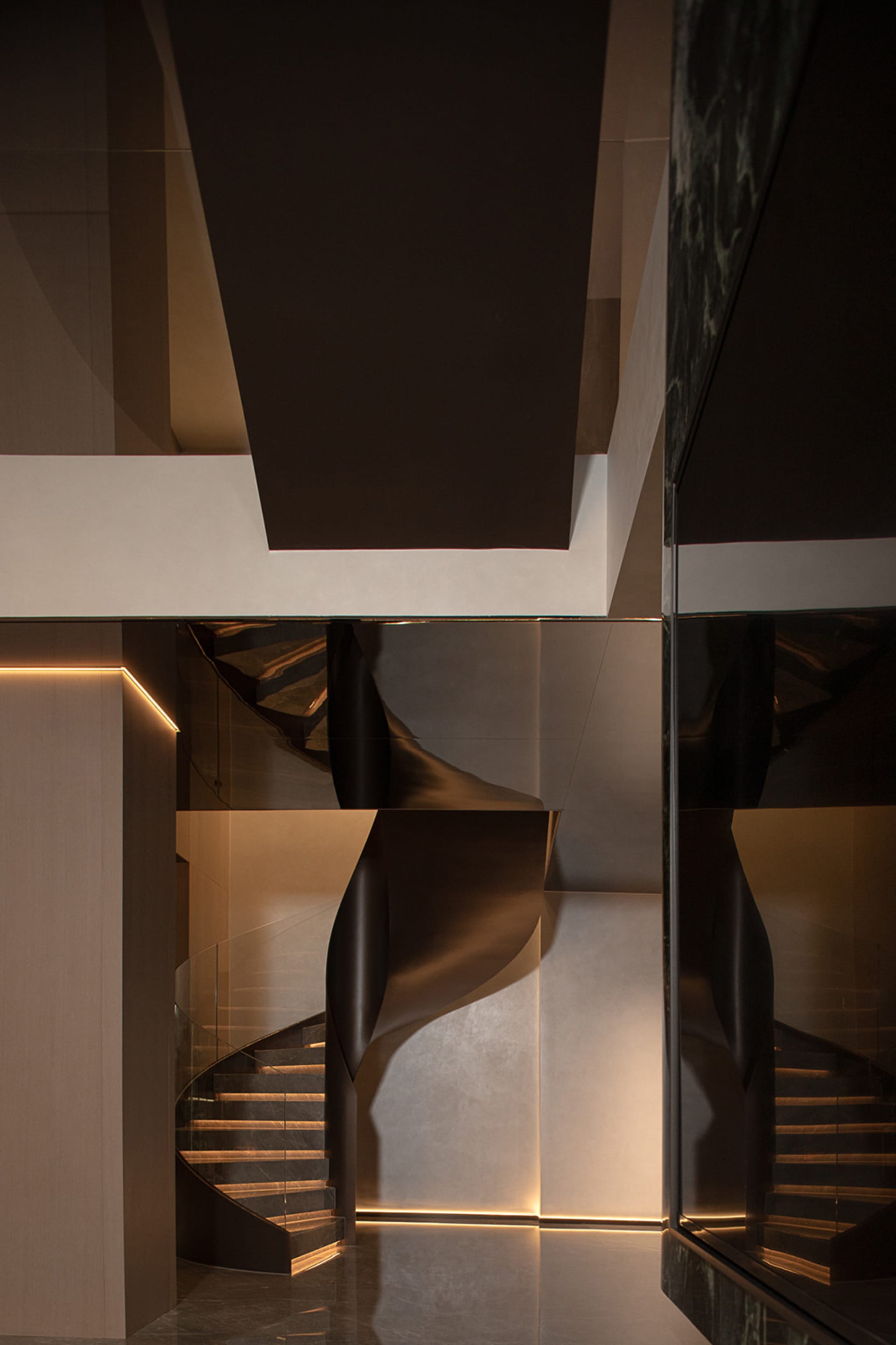 Modern interior design featuring metallic stairs and sleek, minimalist decor.