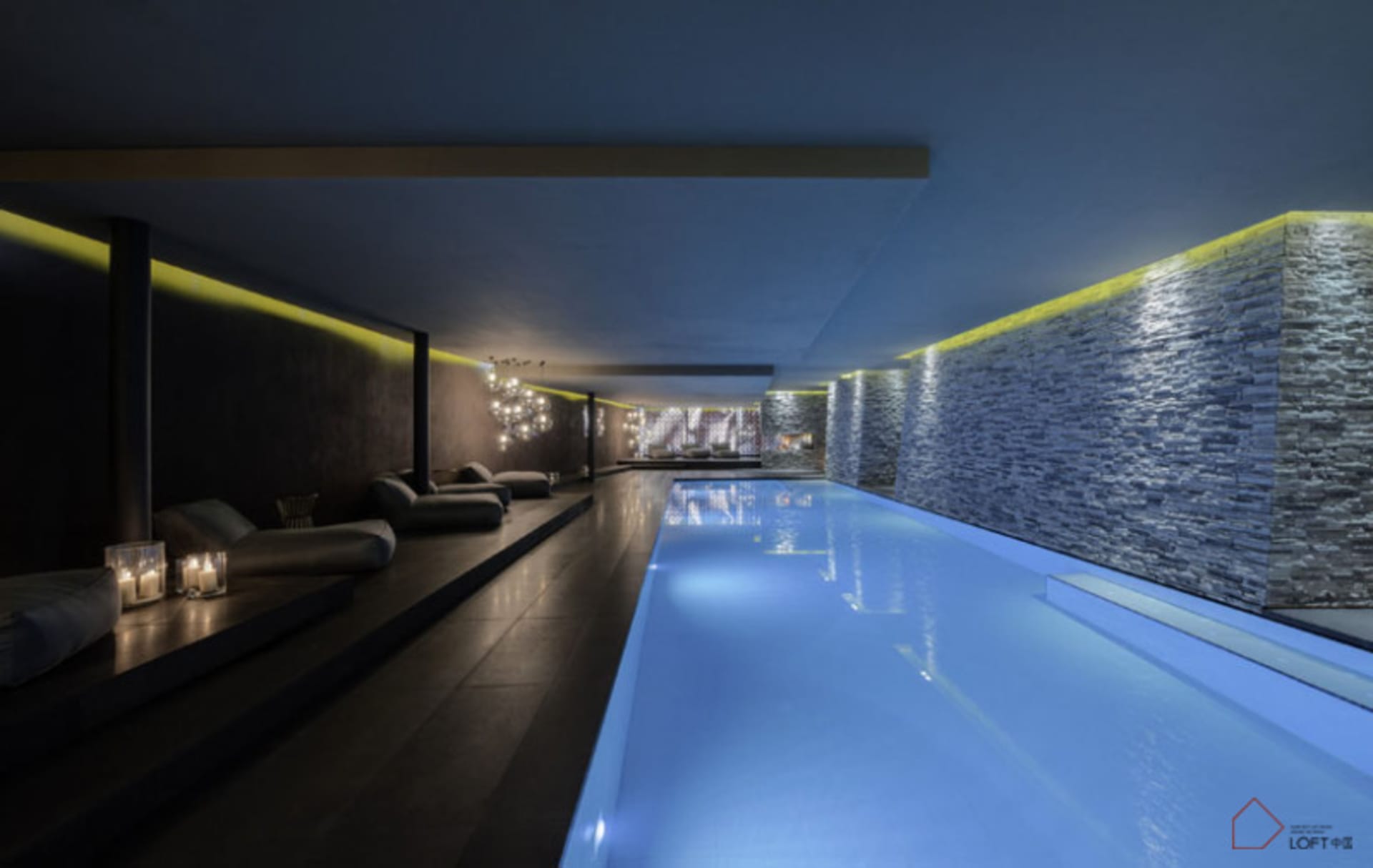 Modern interior design featuring sleek, minimalist living room with concrete walls and glass elements.