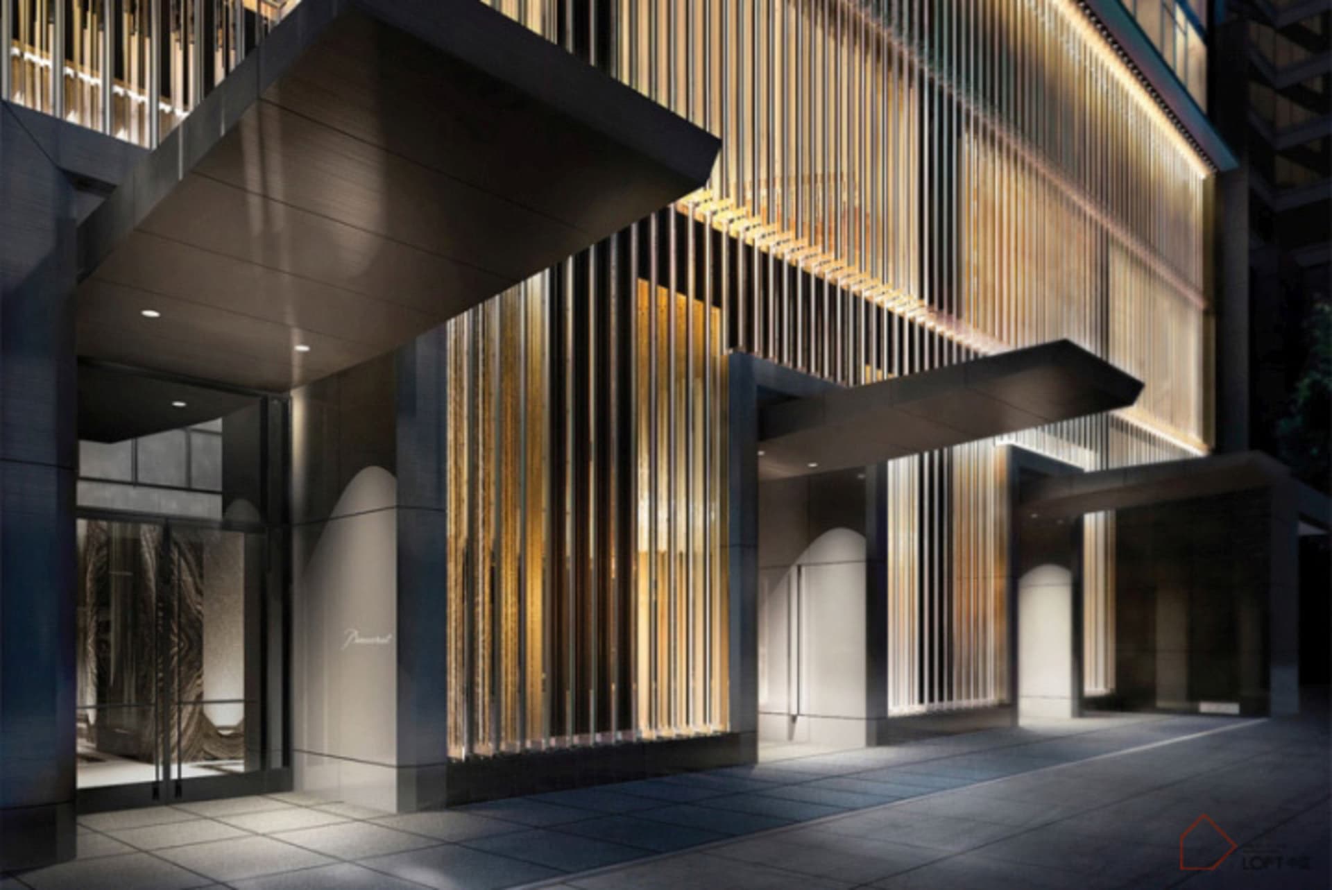 A modern commercial entryway featuring metallic and glass materials.