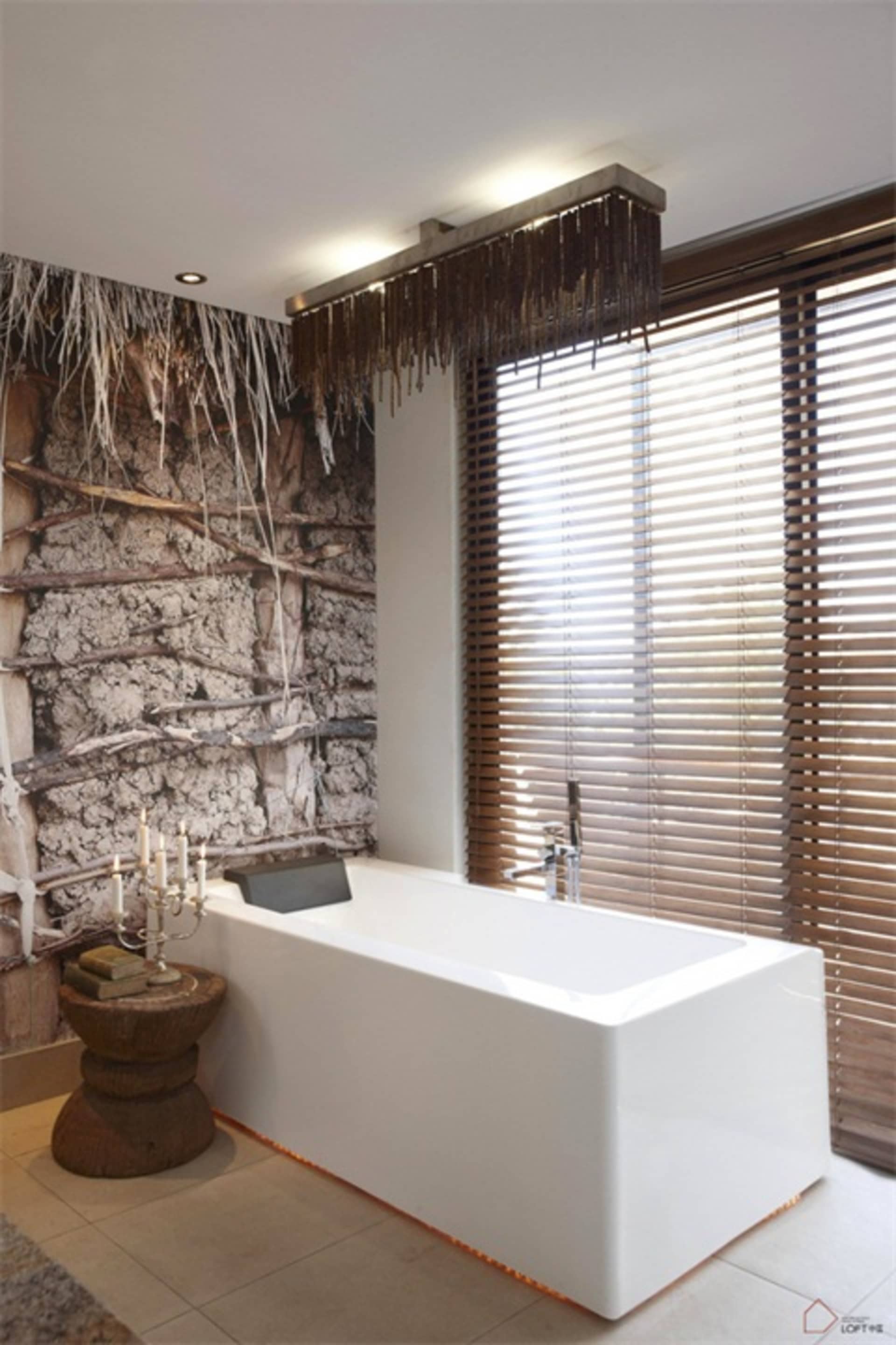 A minimalist bathroom featuring a white bathtub, wooden blinds, and wooden wall decor.
