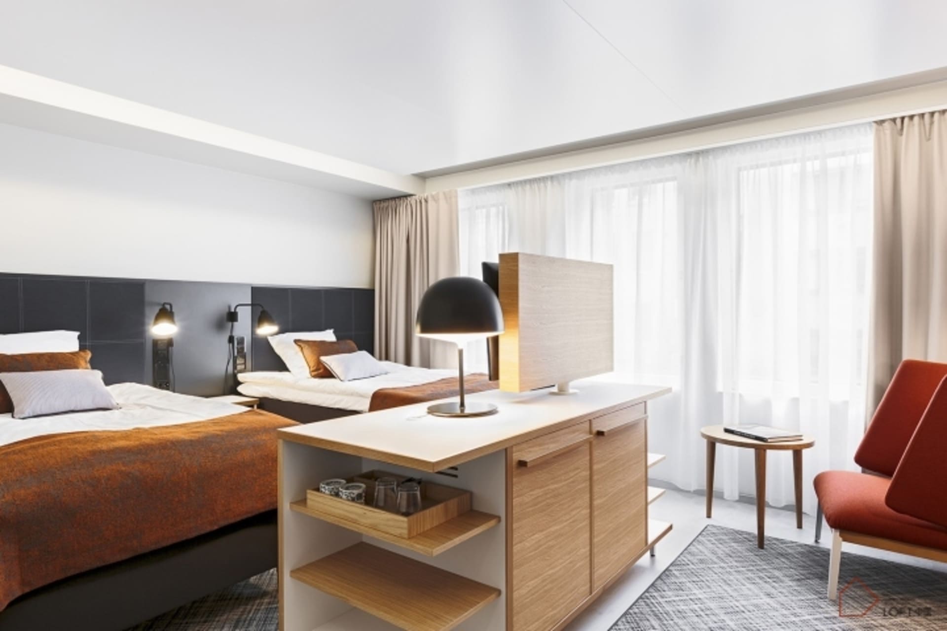 A modern bedroom featuring a wooden desk, bed, and chair.