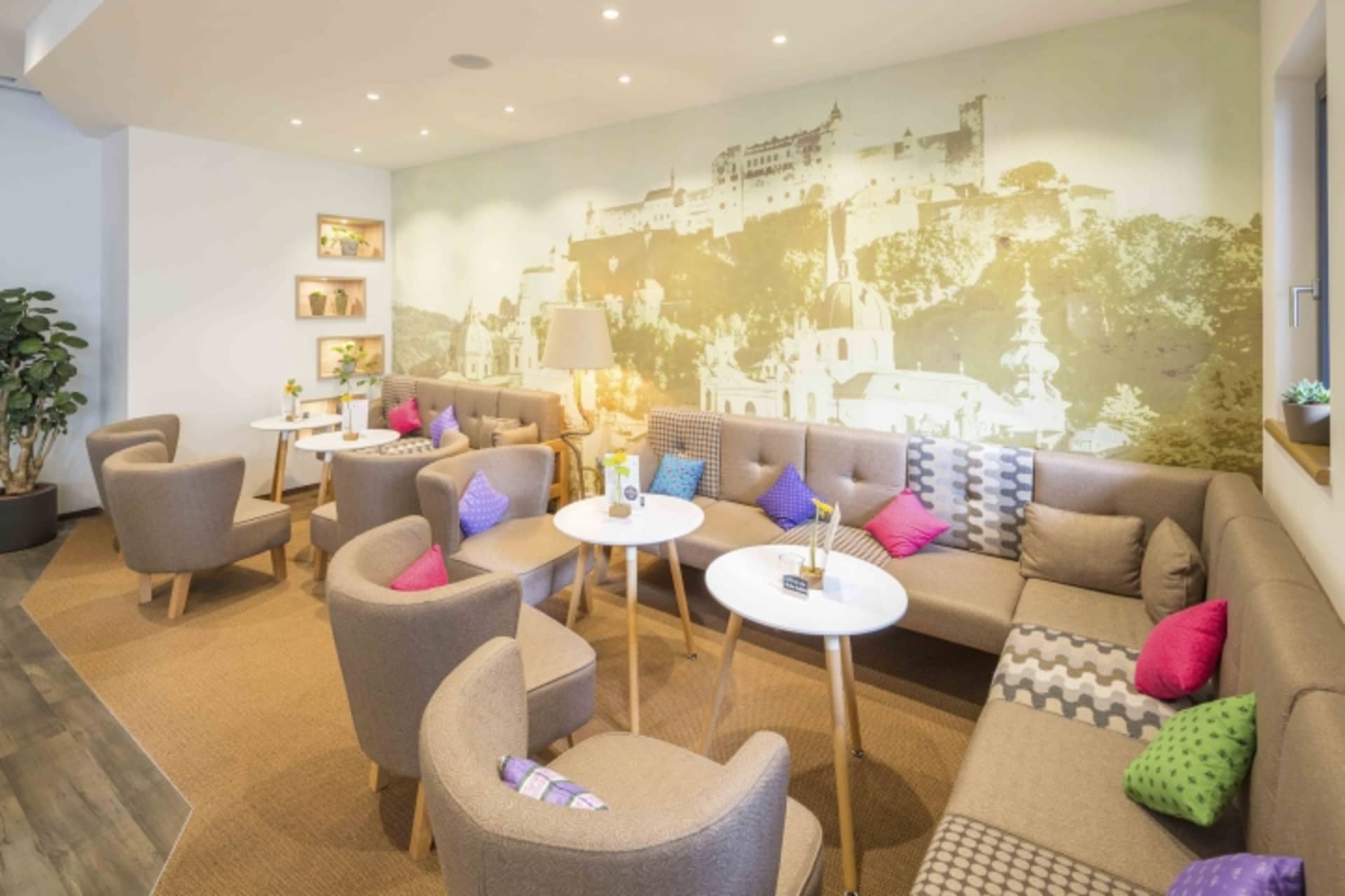 A cozy, modern cafe with comfortable seating and decorative accents.
