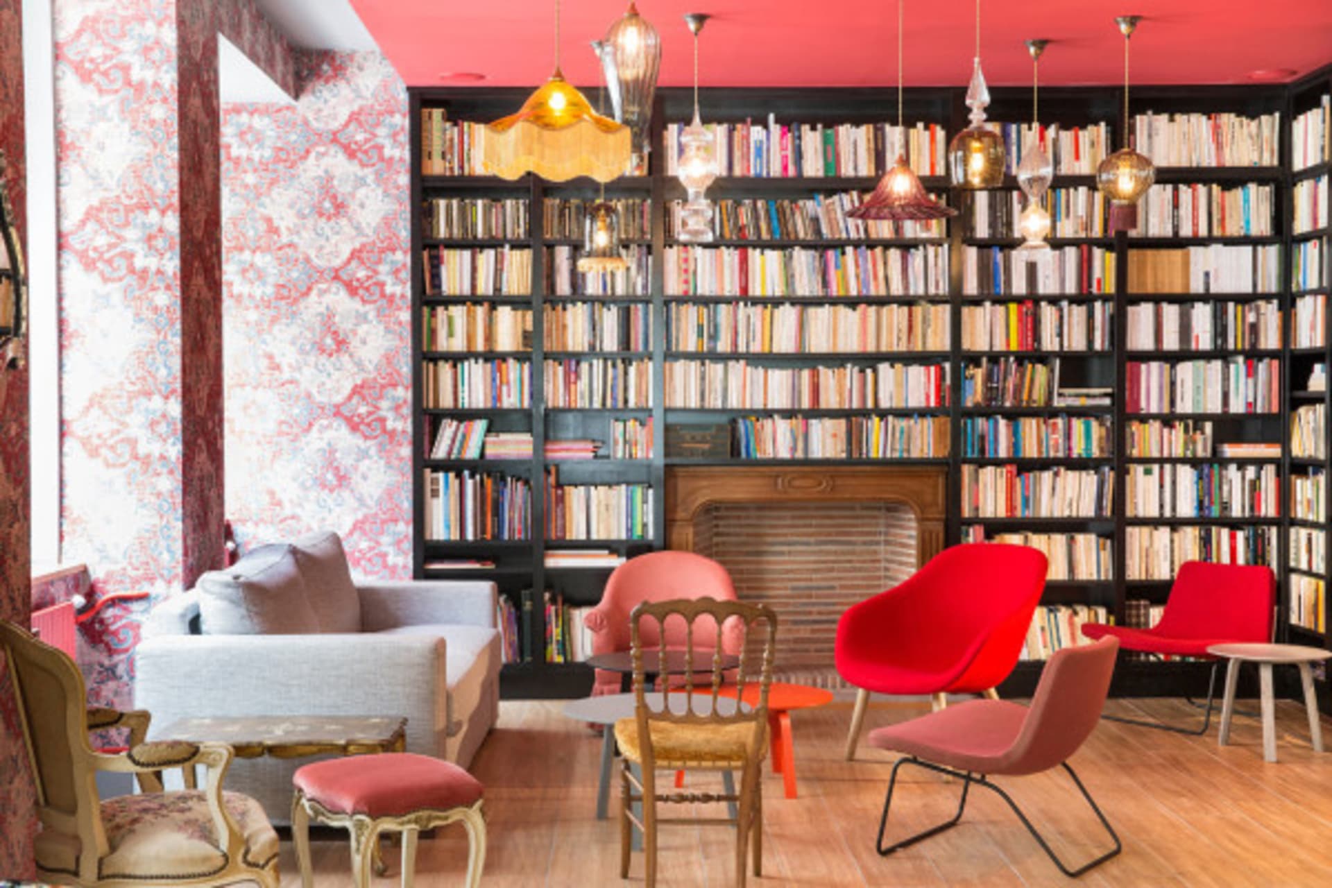 A modern library with a mix of materials and colorful seating.