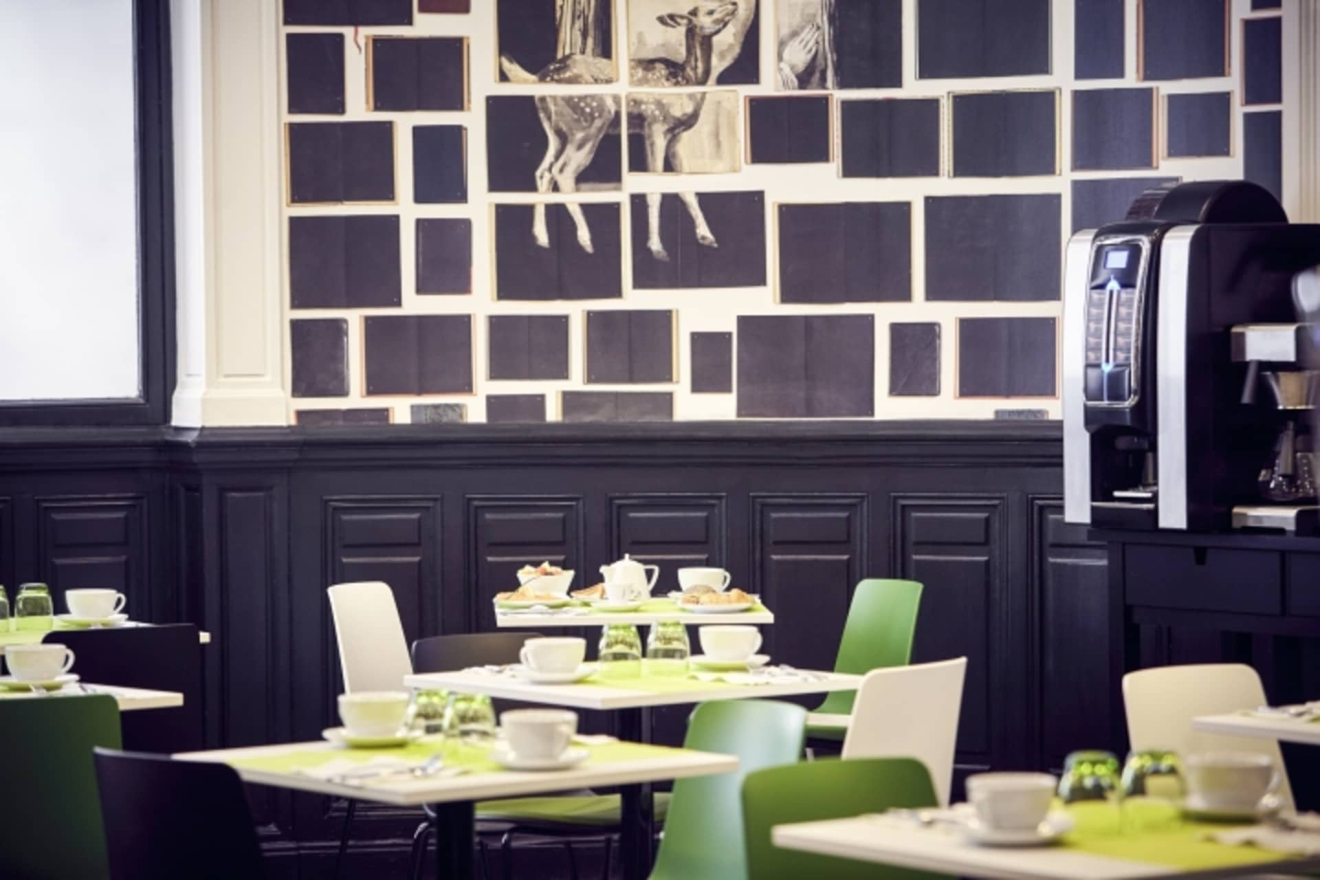 A modern restaurant with black and white color scheme and minimalist design.