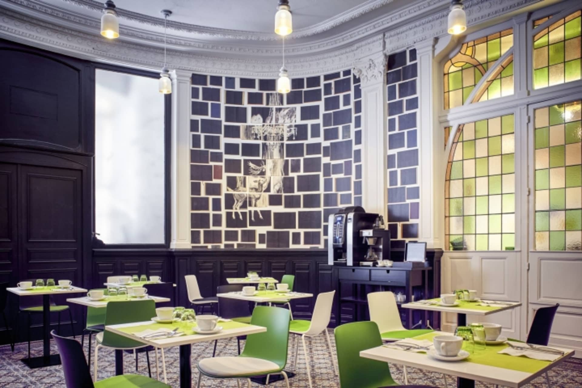 A modern restaurant interior with acrylic and green accents.