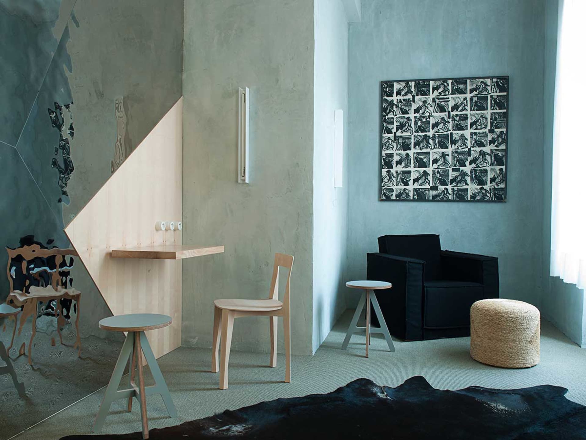A modern industrial living room featuring a concrete wall, wooden furniture, and minimalistic decor.