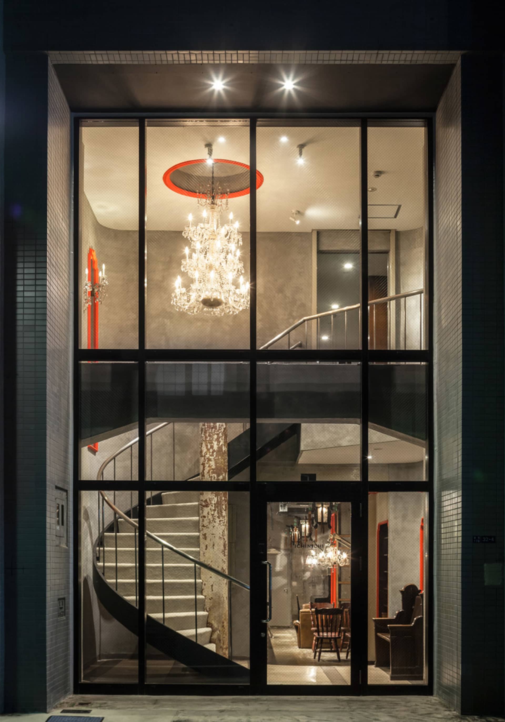 Modern industrial lobby with metallic elements and glass features.