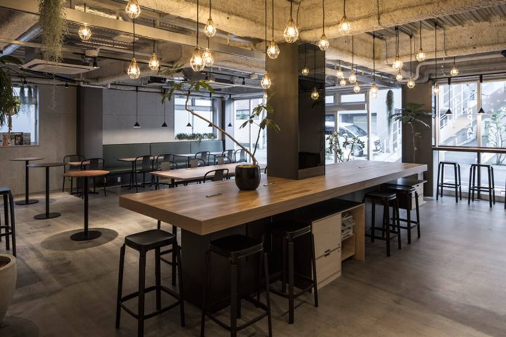 Industrial-style cafe interior with wood and concrete finishes