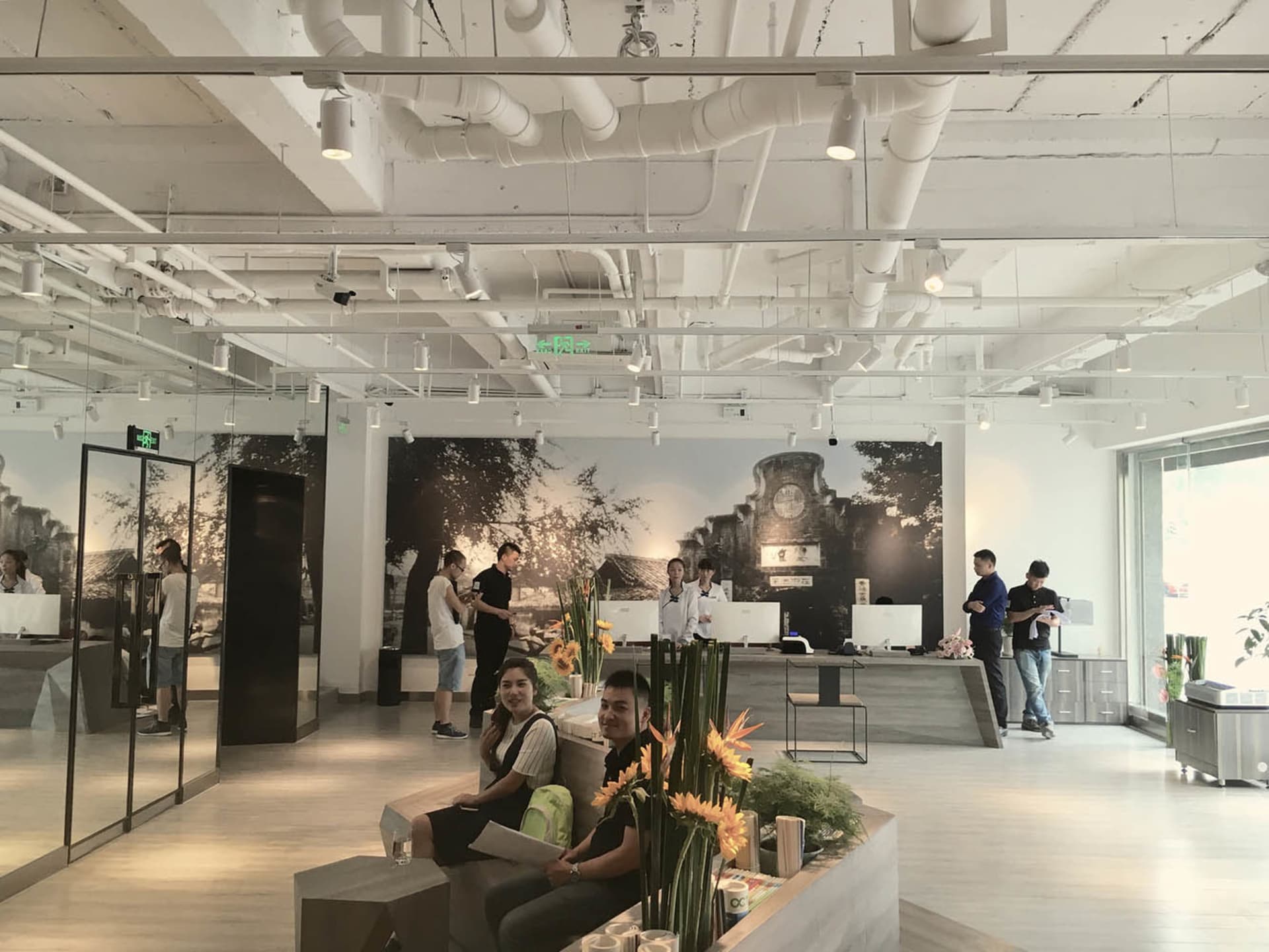 Interior of an industrial-style office with concrete walls and metal furniture