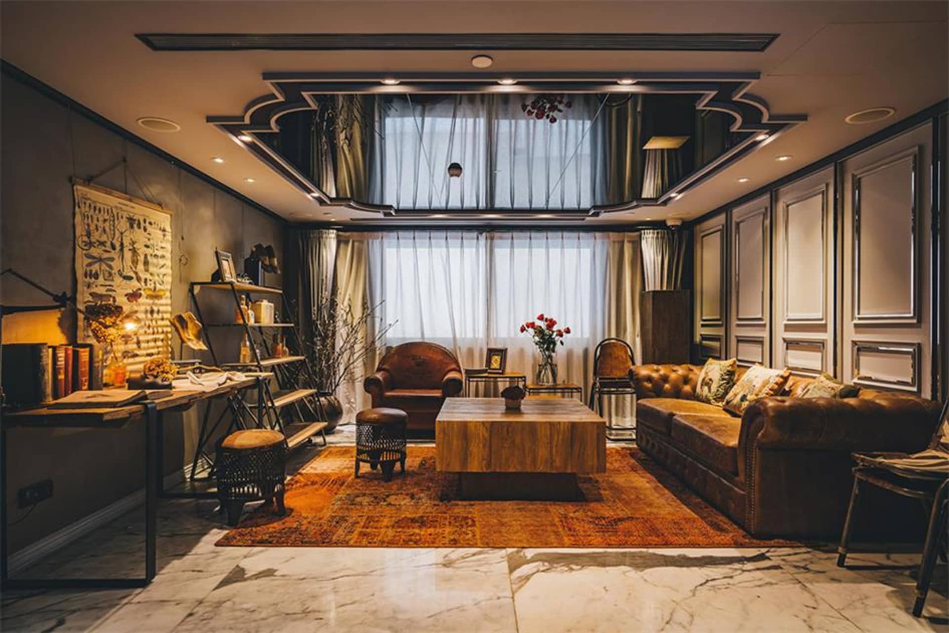 Industrial living room featuring leather furniture, wooden table, and decorative elements.