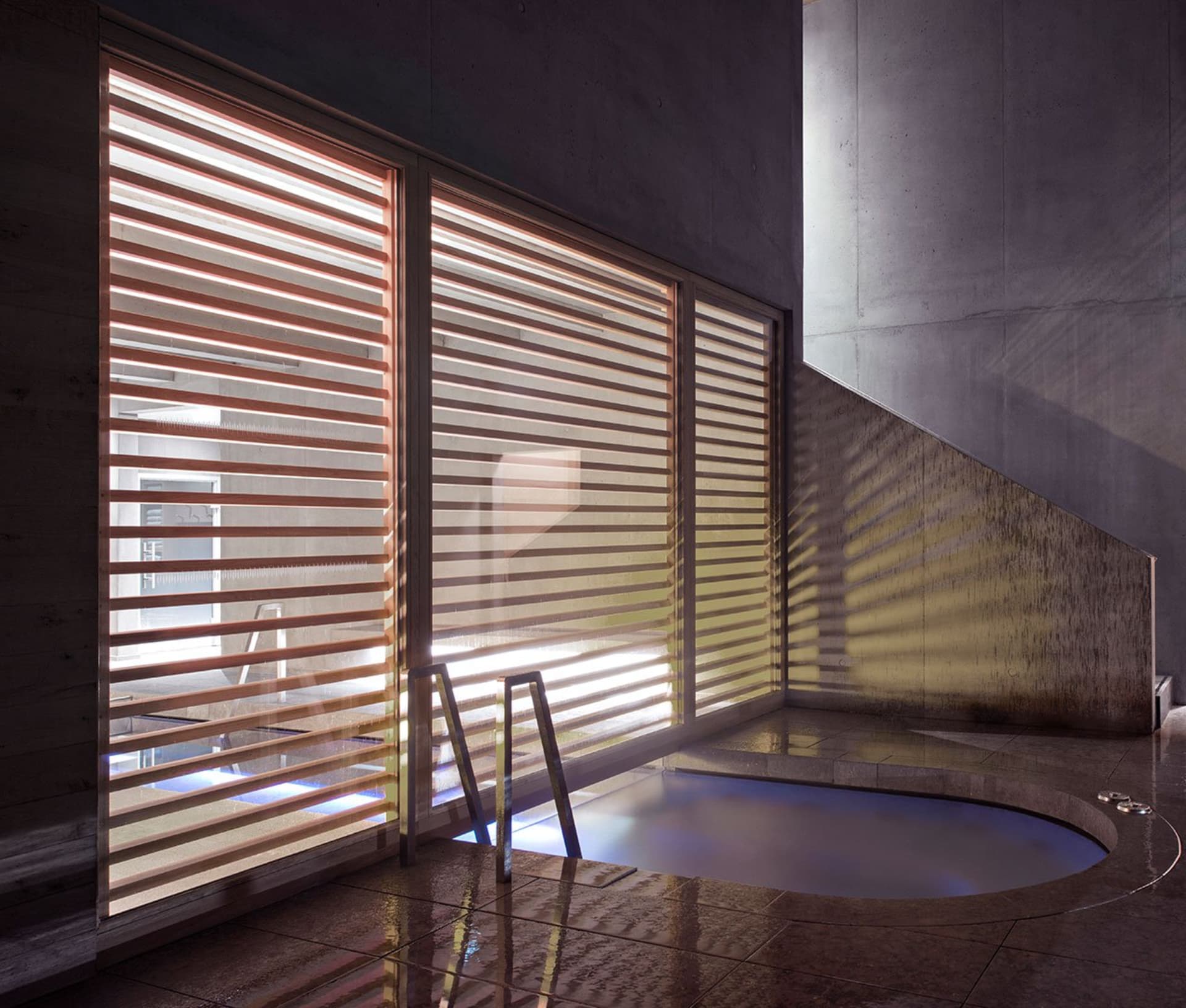 Modern concrete hot tub with sleek, clean lines and minimalistic design.