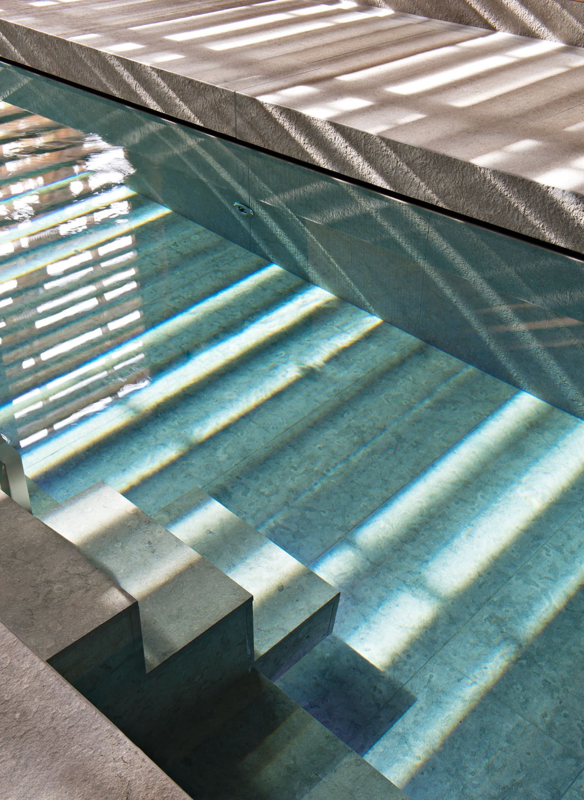 Modern swimming pool designed with concrete material.