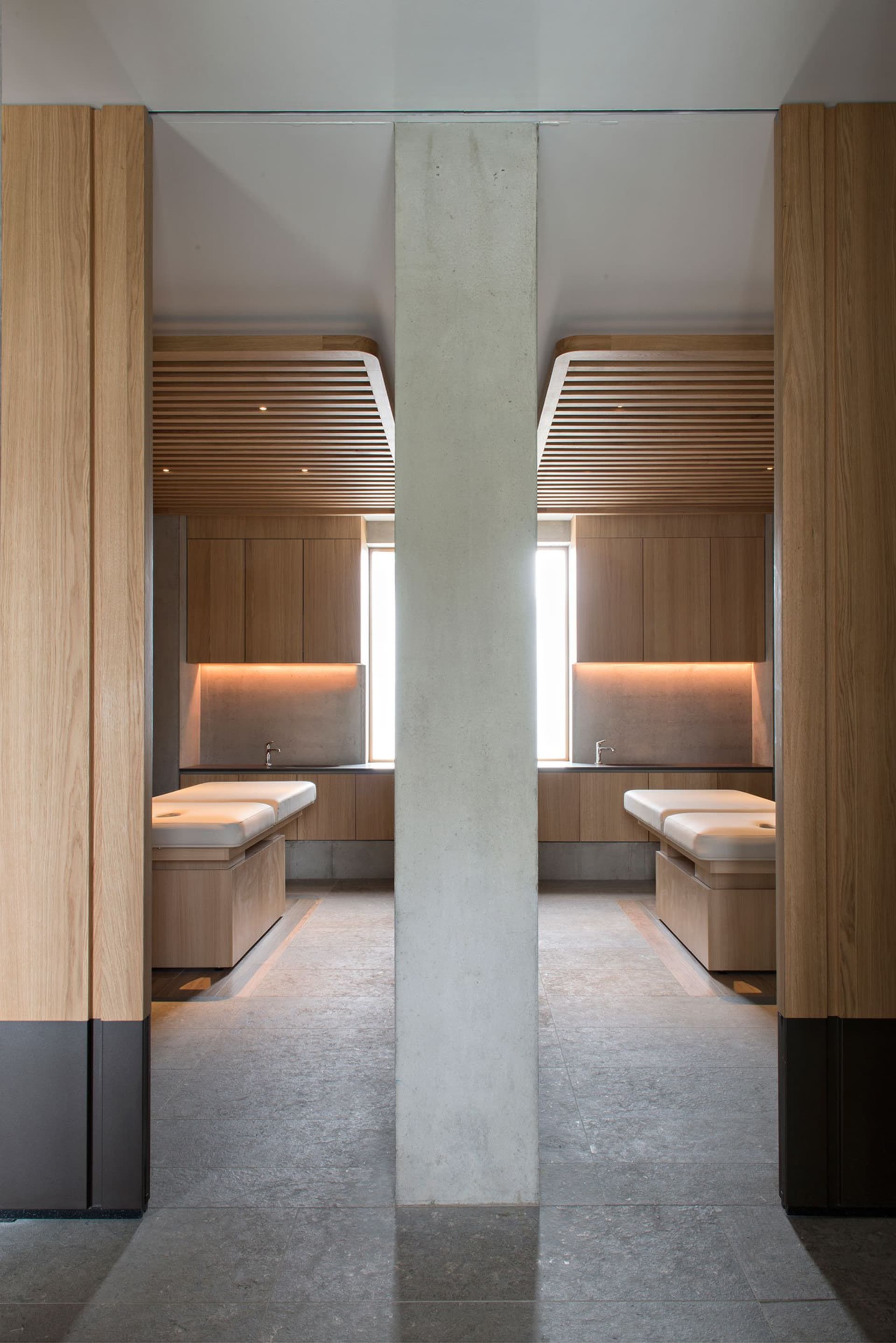 A modern spa interior with wooden elements and minimalistic design.