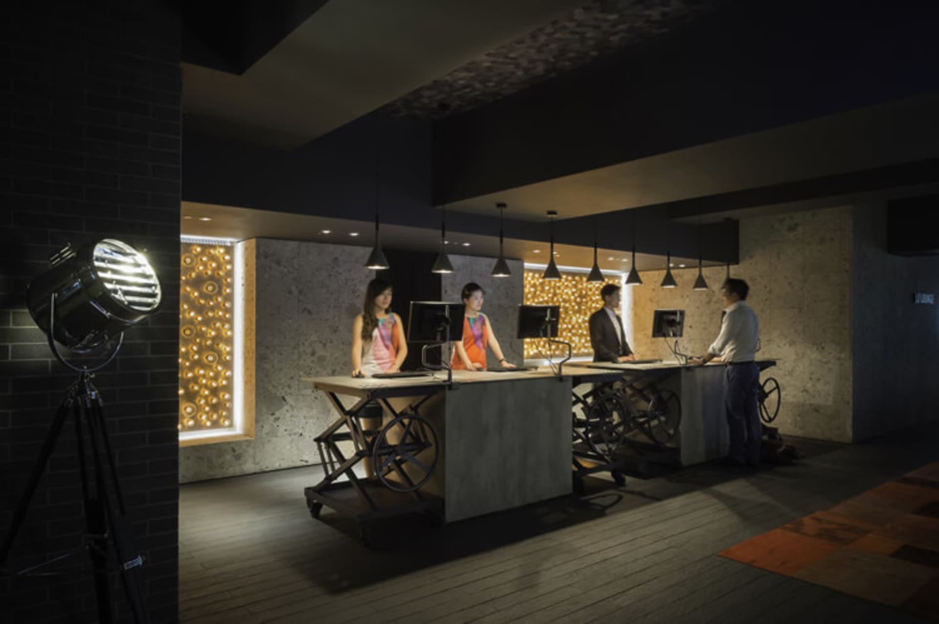 A modern office space featuring concrete materials and a minimalist design.