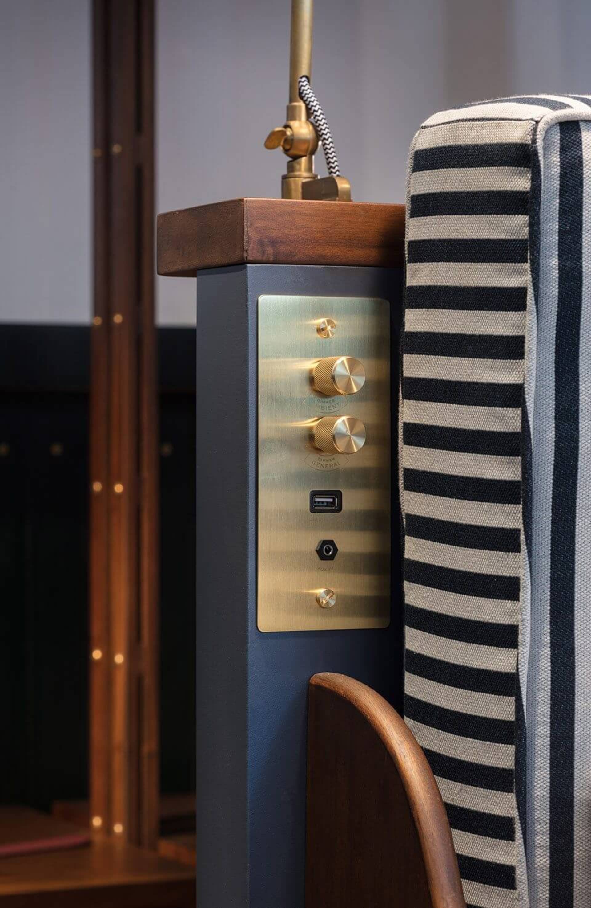 Close-up of an industrial-style sideboard made of metal with a brass finish.