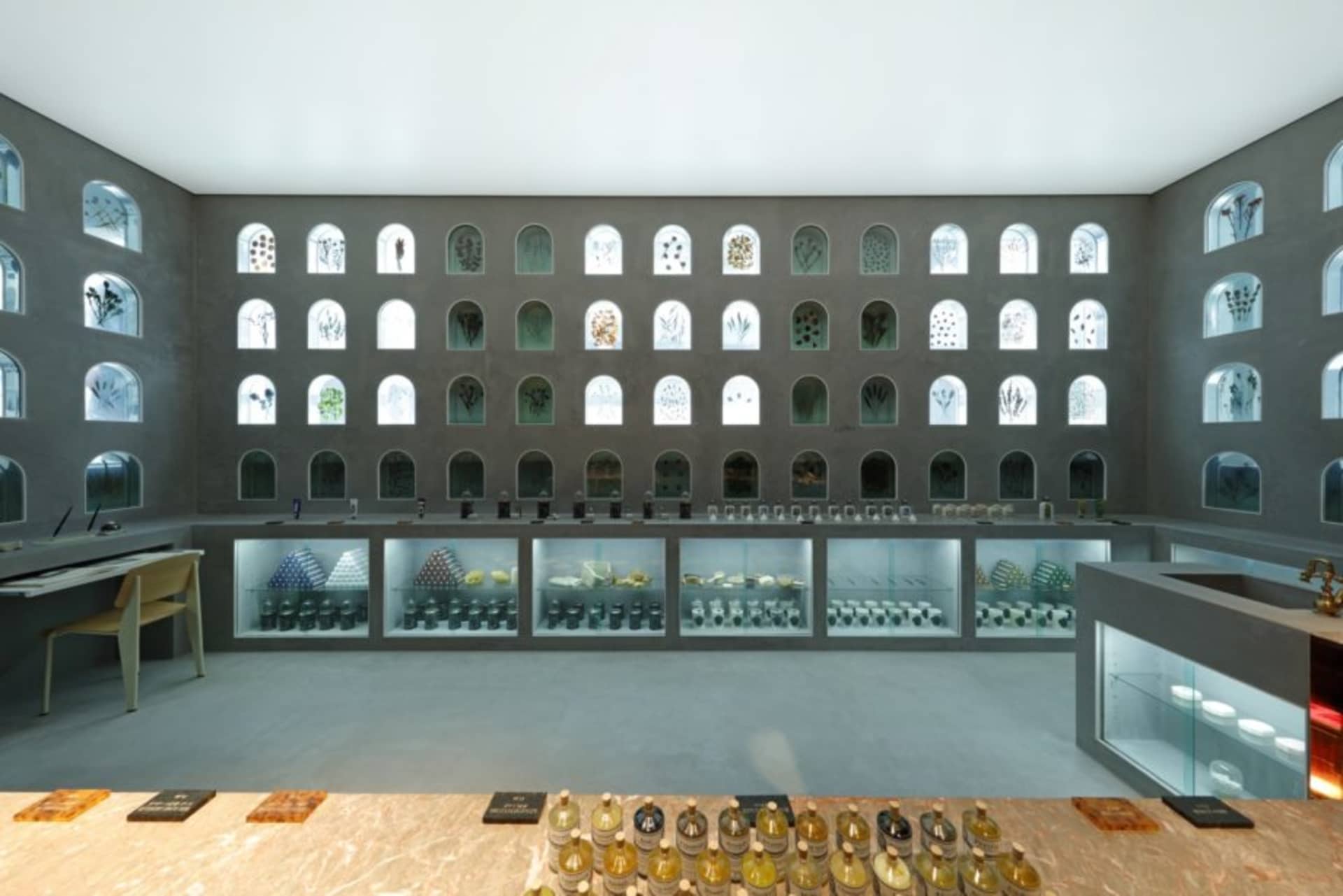A modern interior with glass windows and concrete walls.