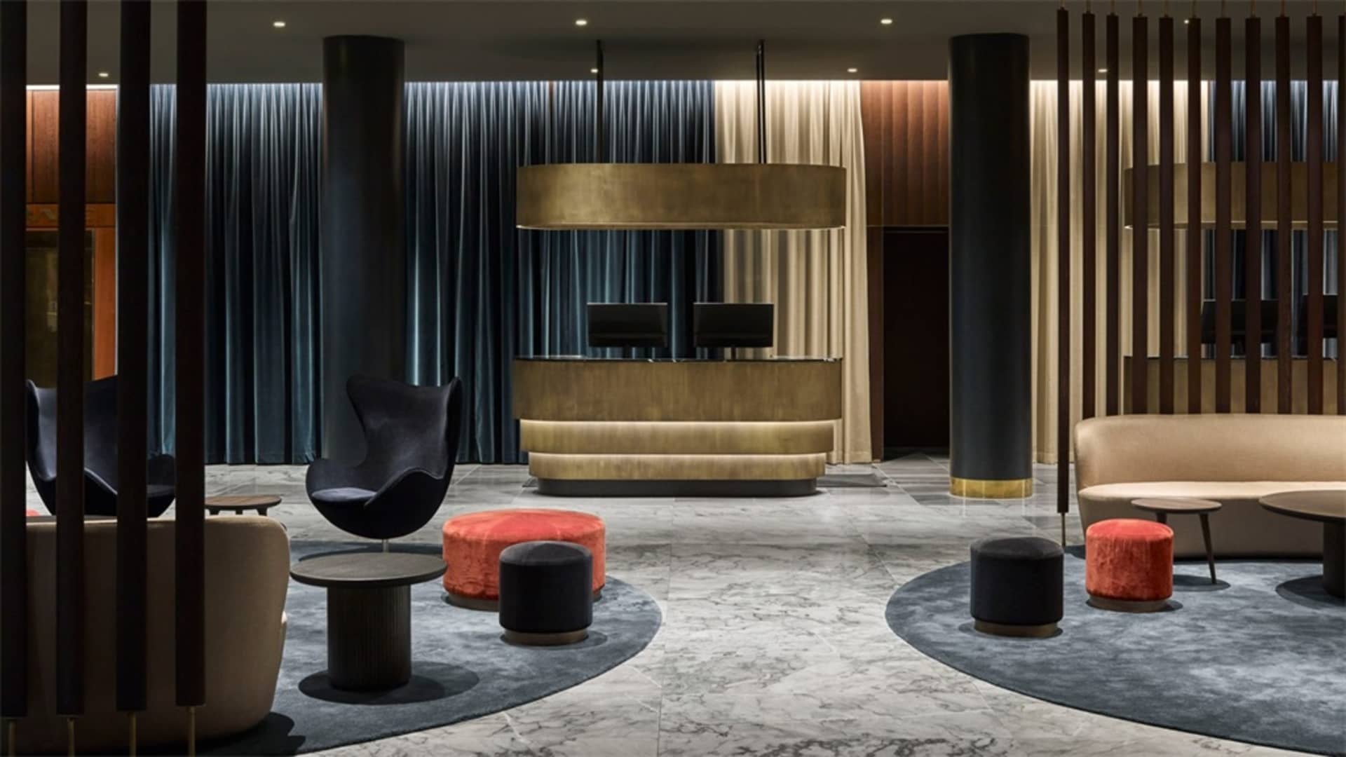 A modern interior space featuring metal, wood, carpet, and marble materials.