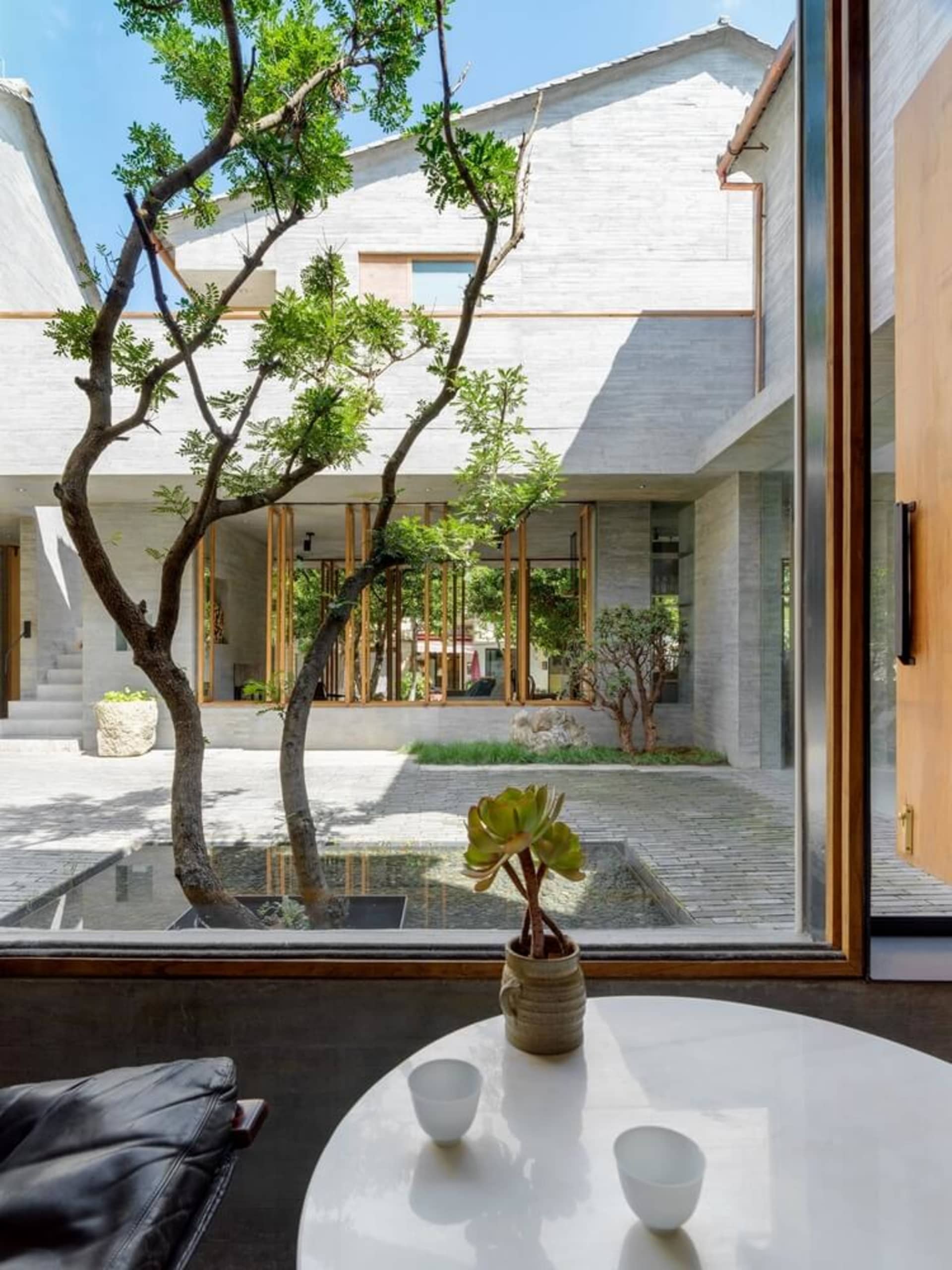 Industrial-style interior design featuring mixed materials and a minimalist aesthetic, showcasing a modern building interior