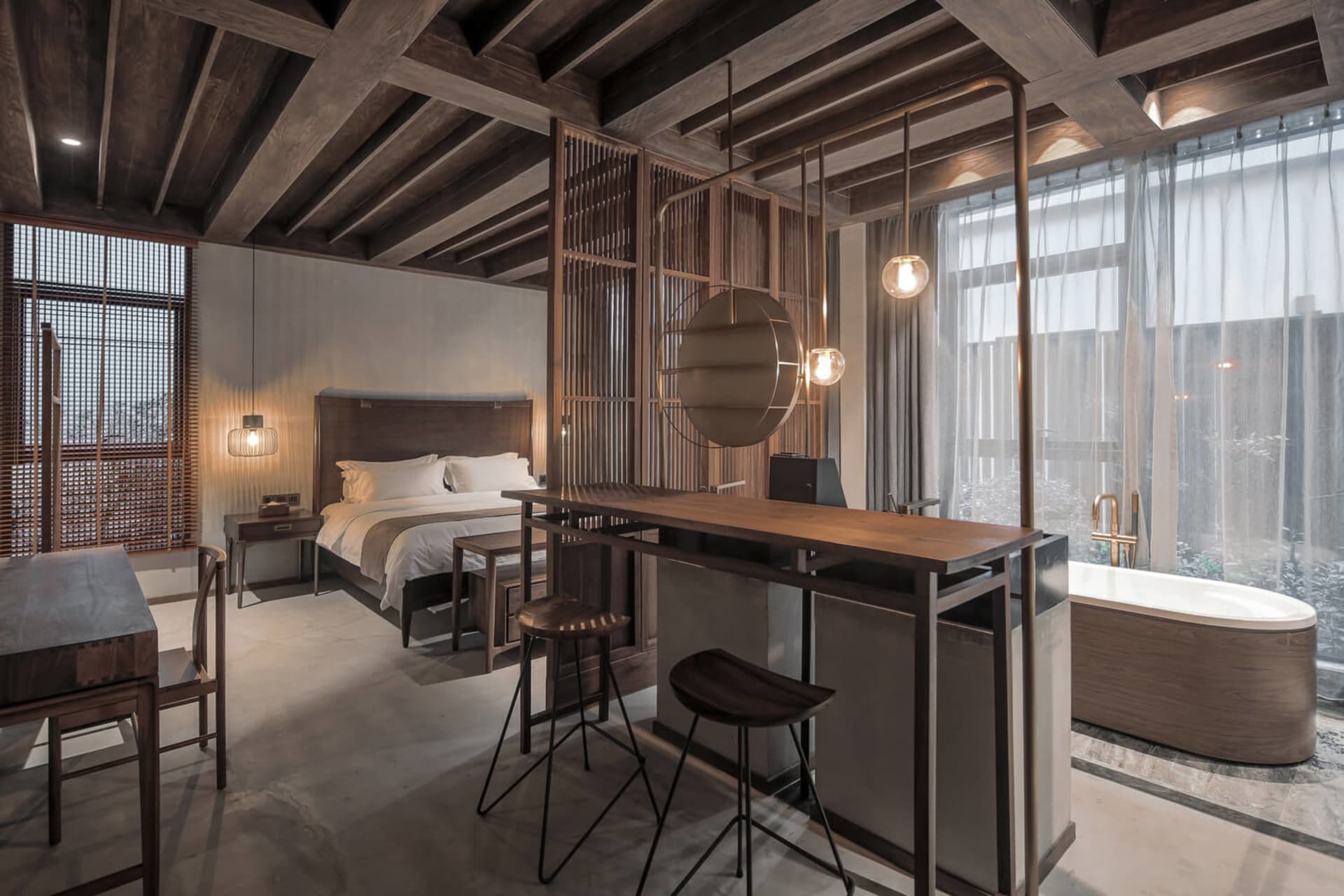 A minimalist bedroom suite featuring wooden furniture and decor.