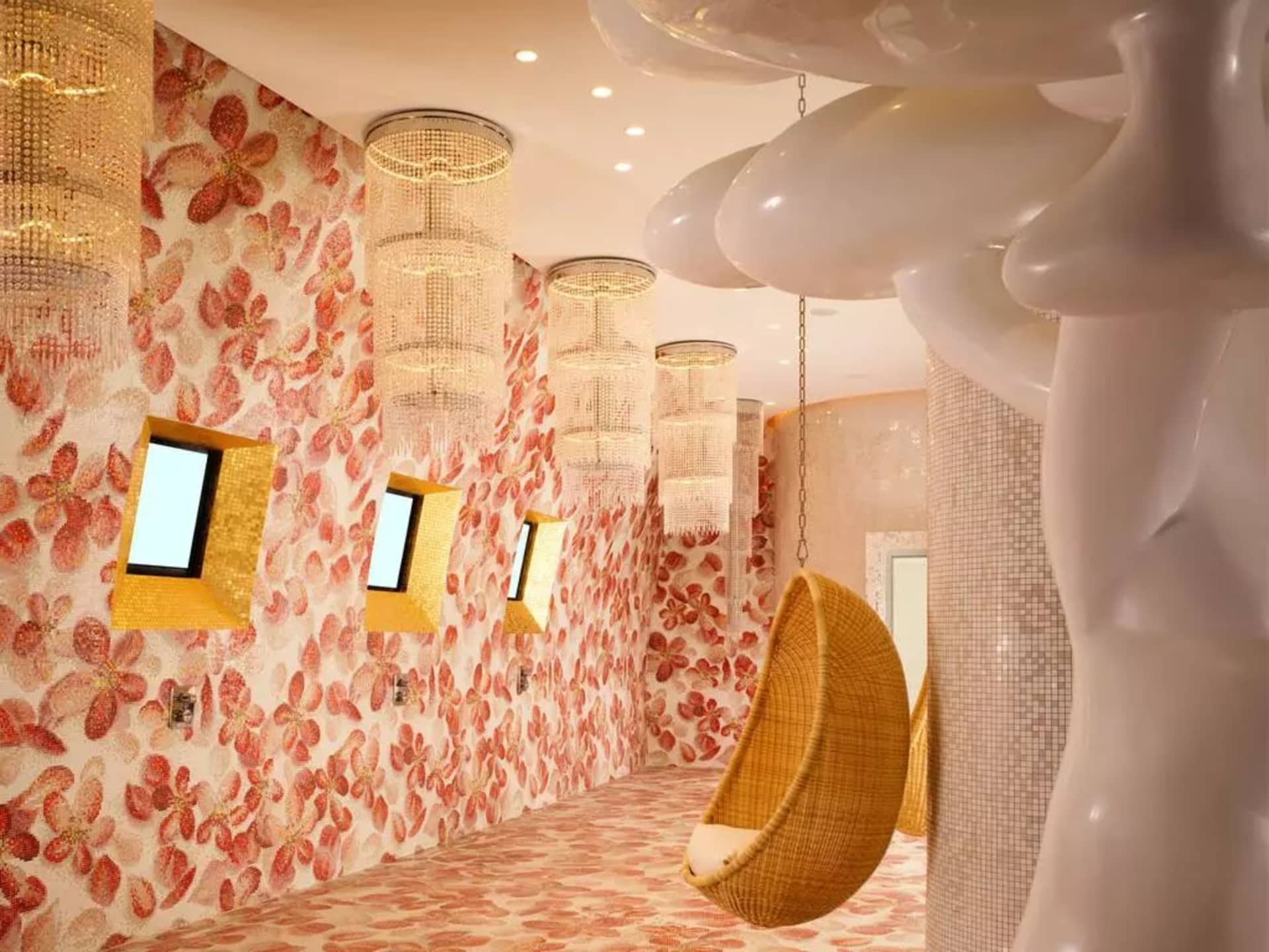 A modern hotel suite with glass walls and a spacious interior.