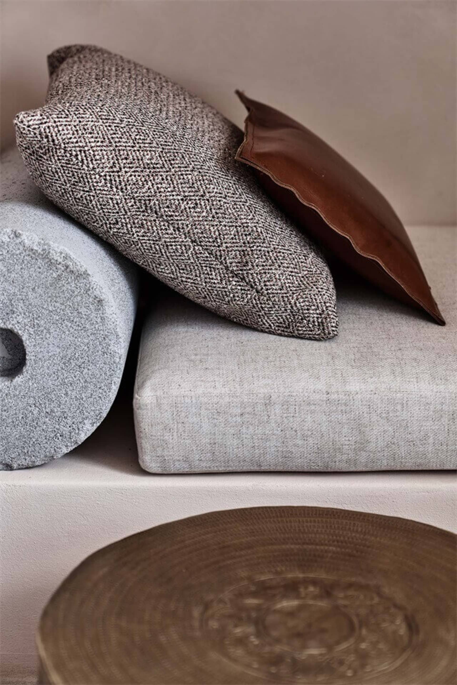 Soft textile cushions and fabric materials for interior design purposes.